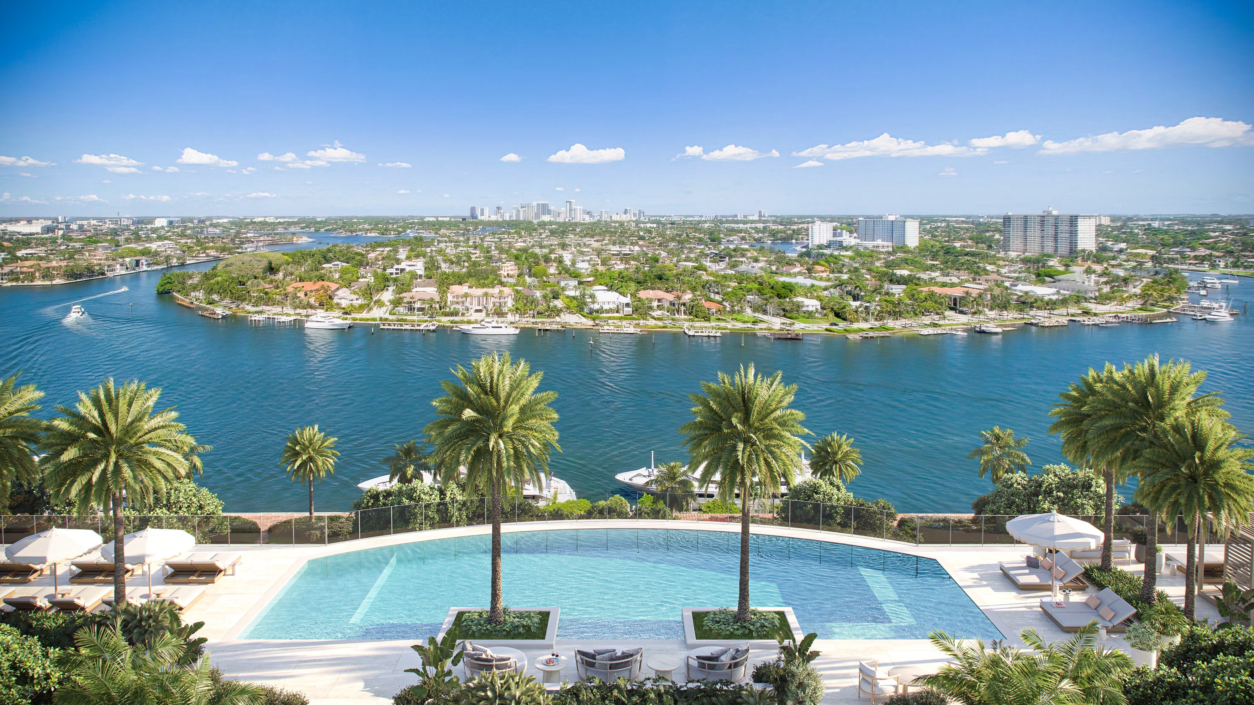 St. Regis Bahia Mar Residences waterfront pool with skyline views in Fort Lauderdale; luxury resort amenity for ultra luxury condos, preconstruction at Bahia Mar. Featuring view.