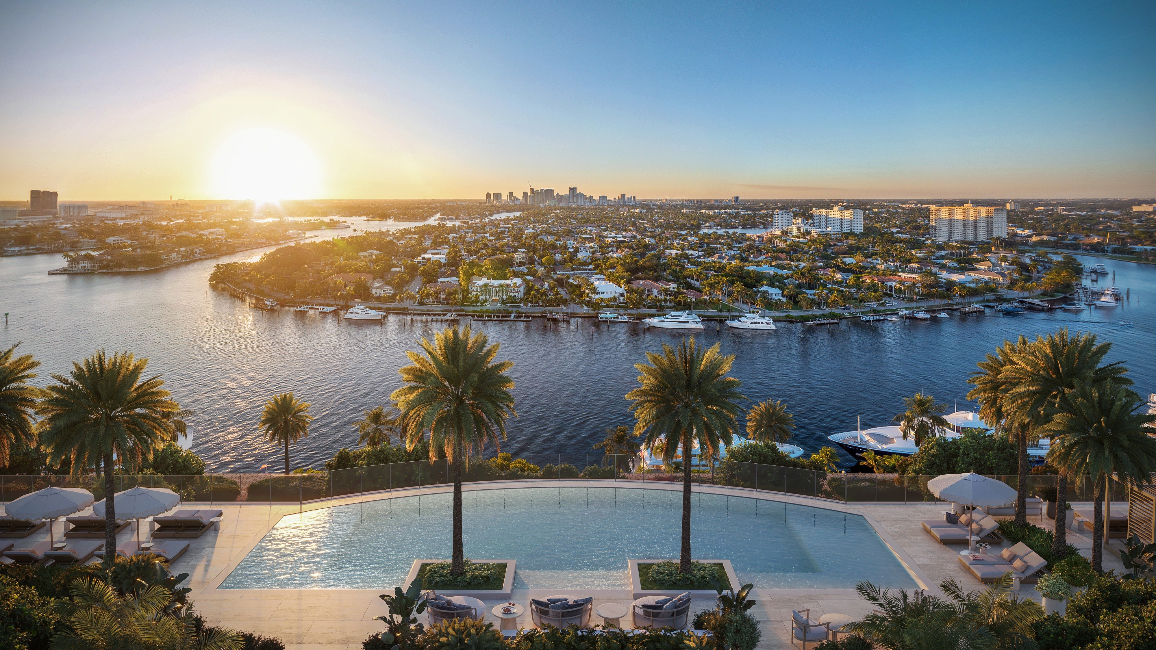 St. Regis Bahia Mar Residences riverfront poolscape at sunset in Fort Lauderdale; luxury lifestyle for ultra luxury condos, preconstruction at Bahia Mar.