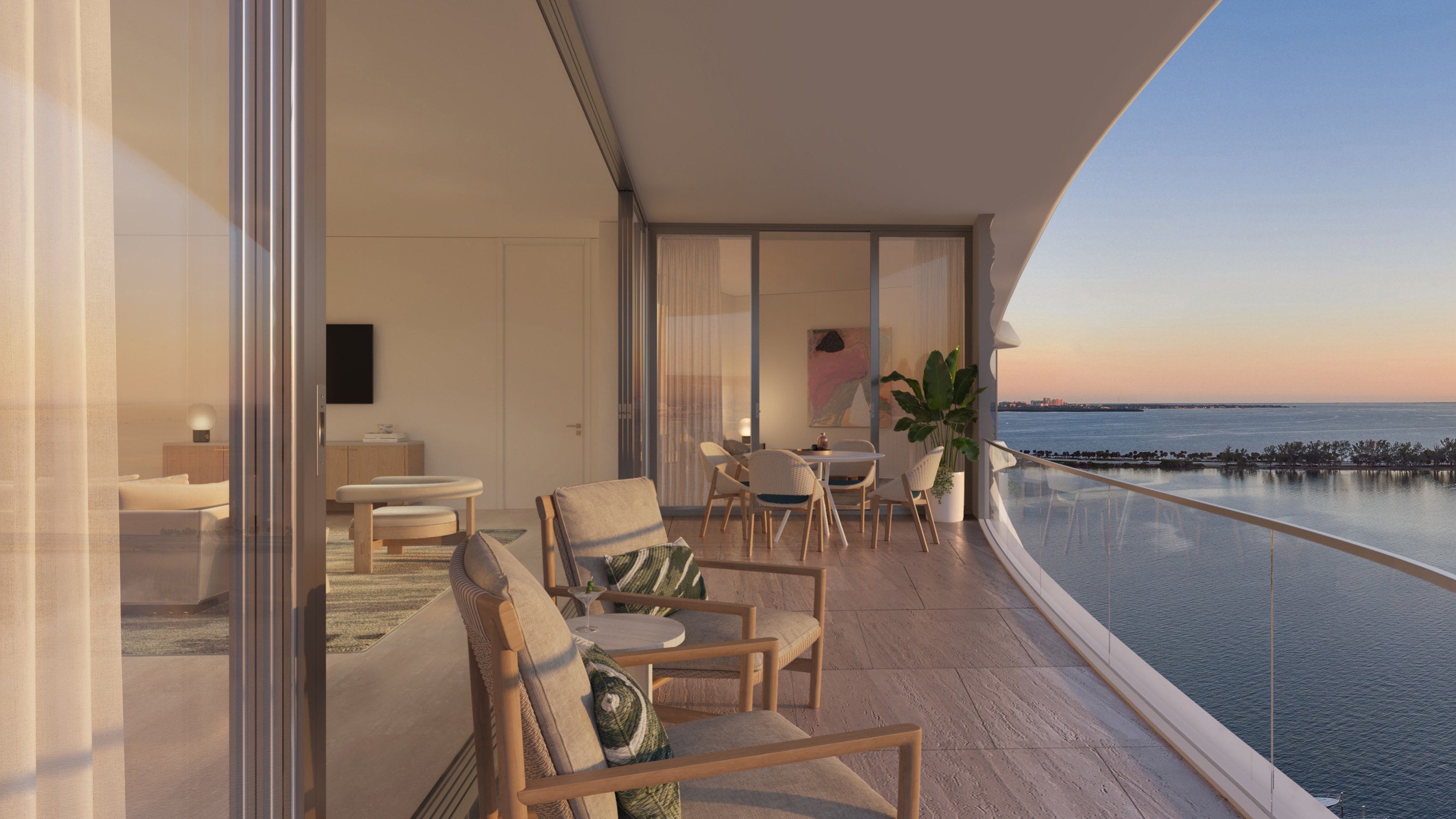 St. Regis Brickell, Brickell Miami balcony at sunset over Biscayne Bay, panoramic views for luxury and ultra luxury condos; preconstruction. Featuring modern and view.