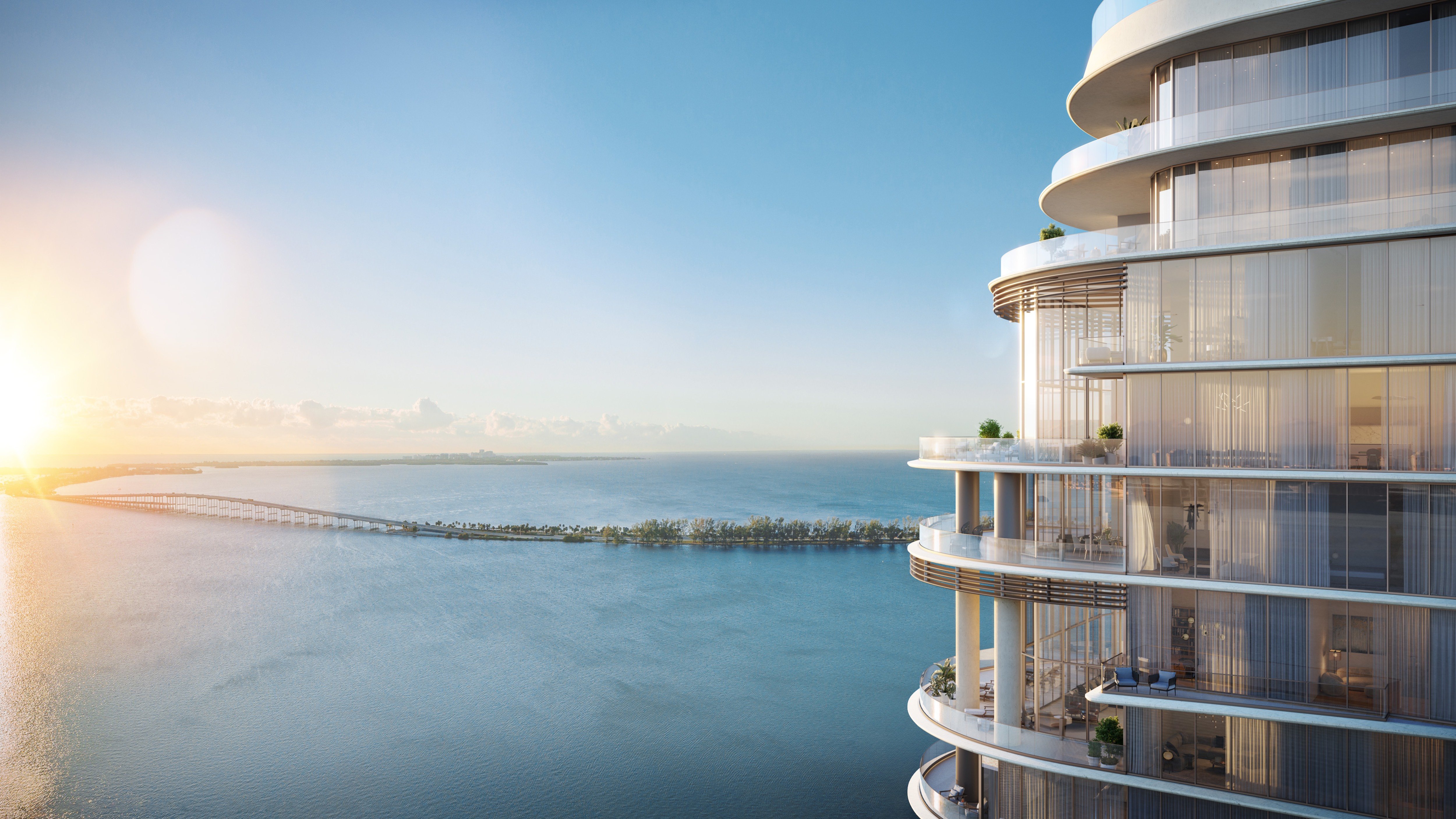 St. Regis Brickell, Brickell Miami coastal apartment at sunset—open living with bay views in luxury and ultra luxury condos; preconstruction.