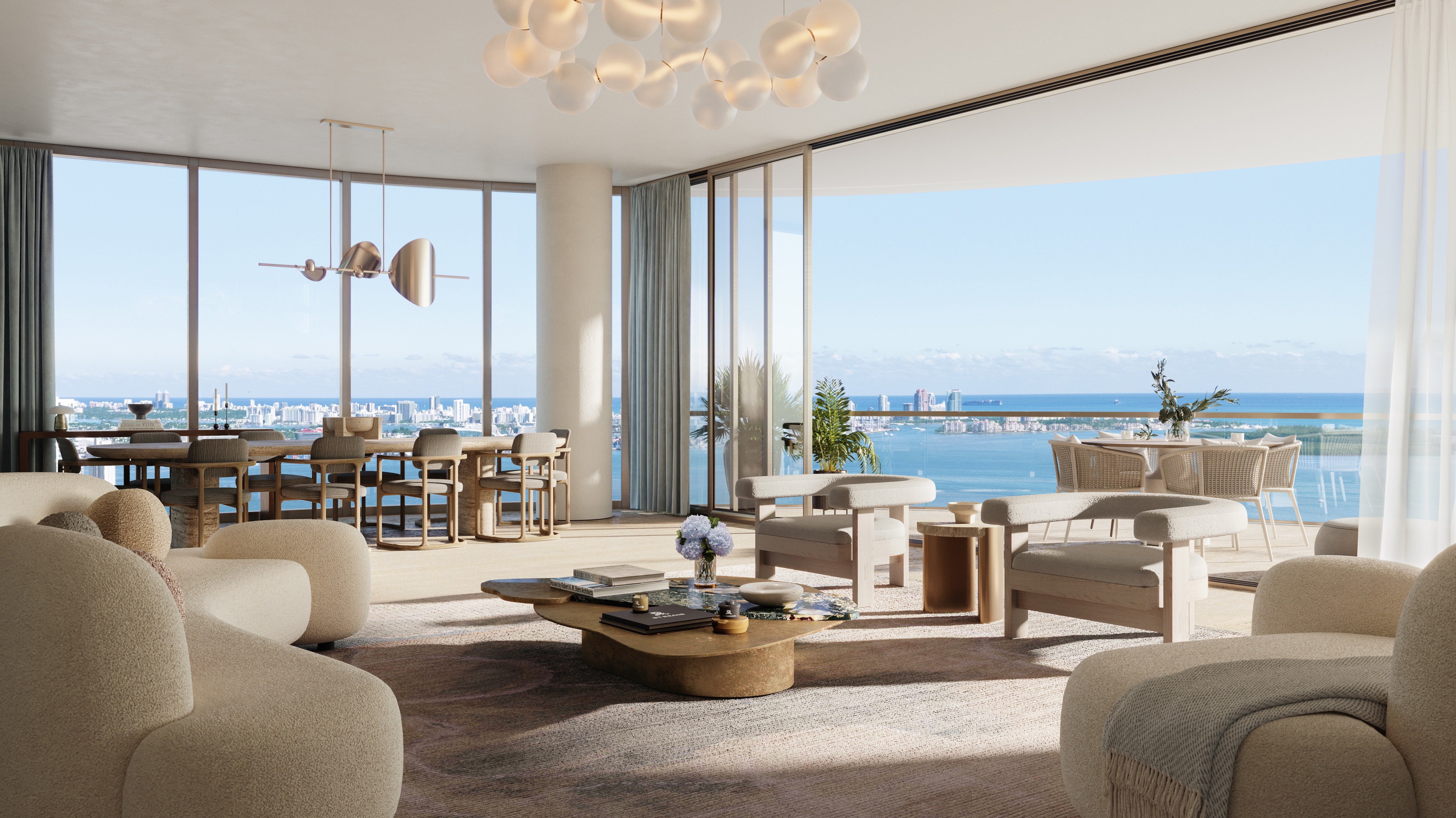 St. Regis Brickell, Brickell Miami living area with panoramic bay view through floor‑to‑ceiling glass—signature outlook for luxury and ultra luxury condos; preconstruction.