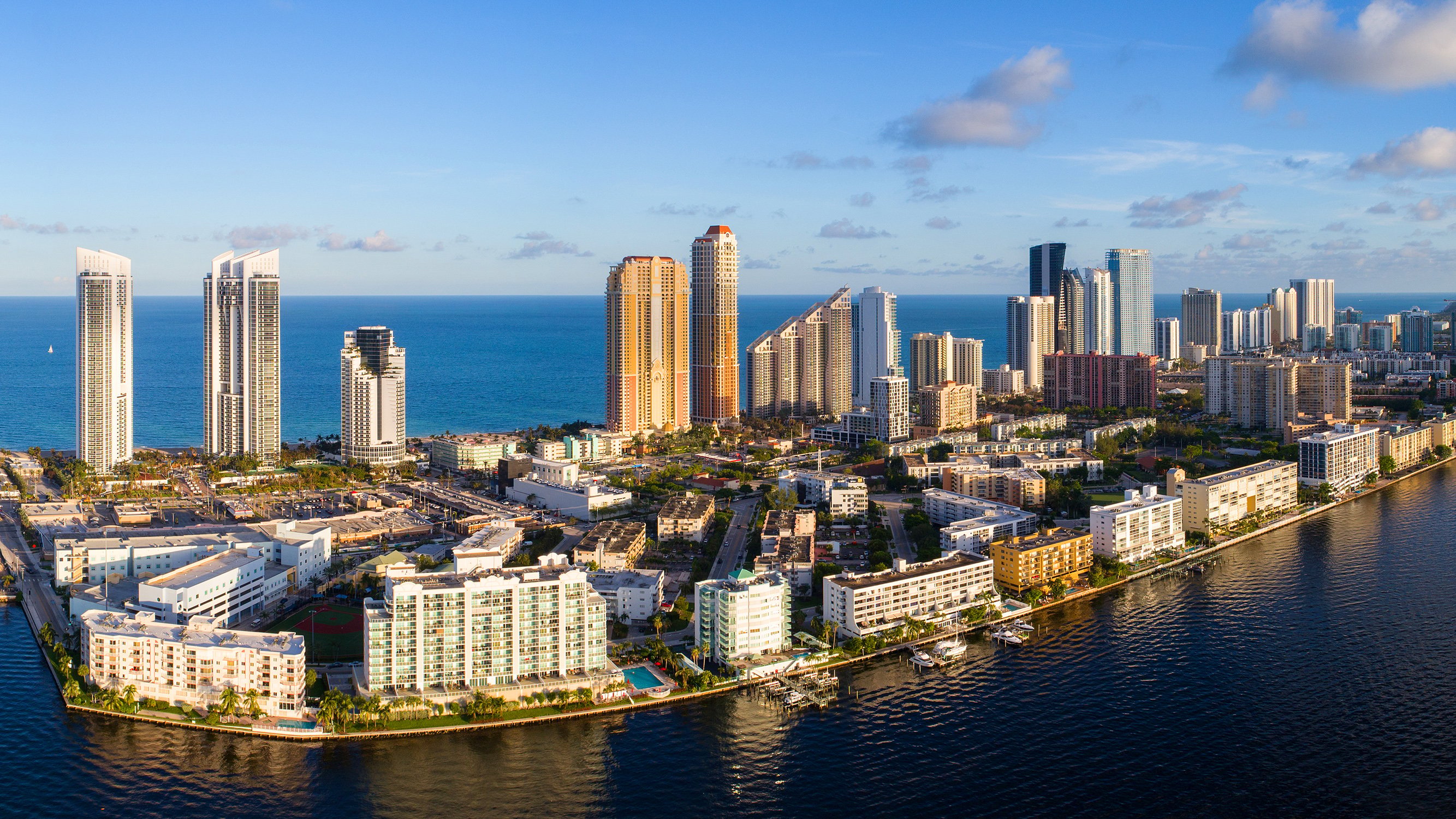 Sunny Isles Beach, Miami skyline aerial with ocean and Intracoastal, iconic strip of luxury and ultra luxury condos; preconstruction and resale. Featuring view.