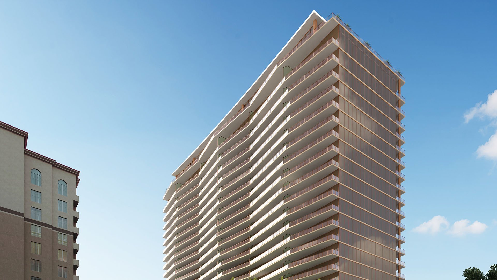 Corner view of the condo tower with wraparound balconies rising against a blue sky at The Berkeley in West Palm Beach, showcasing luxury and ultra luxury condos with a striking modern façade.