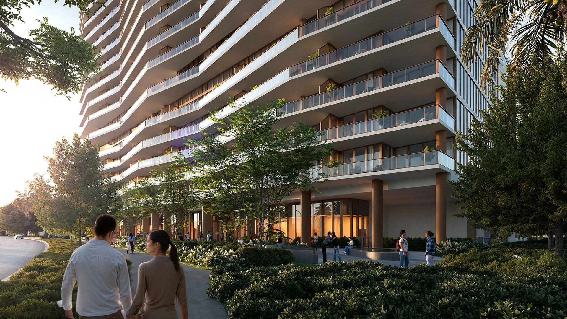 Landscaped arrival walkway beneath the curving condo façade at The Berkeley in West Palm Beach, highlighting luxury and ultra luxury condos with lush streetfront architecture and pedestrian-friendly design.