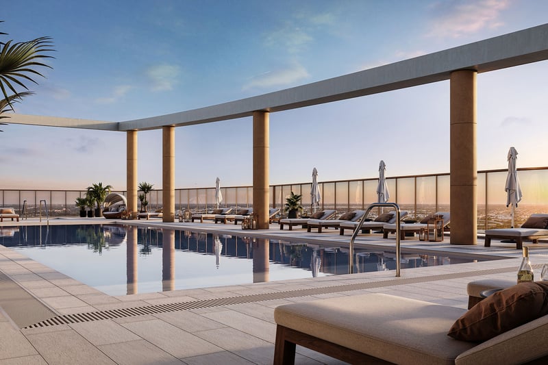 Rooftop pool terrace with a nest daybed, loungers, and skyline views at The Berkeley in West Palm Beach, showcasing luxury and ultra luxury condos with resort-style outdoor amenities.