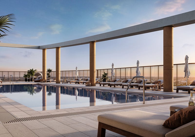 Rooftop pool terrace with a nest daybed, loungers, and skyline views at The Berkeley in West Palm Beach, showcasing luxury and ultra luxury condos with resort-style outdoor amenities.