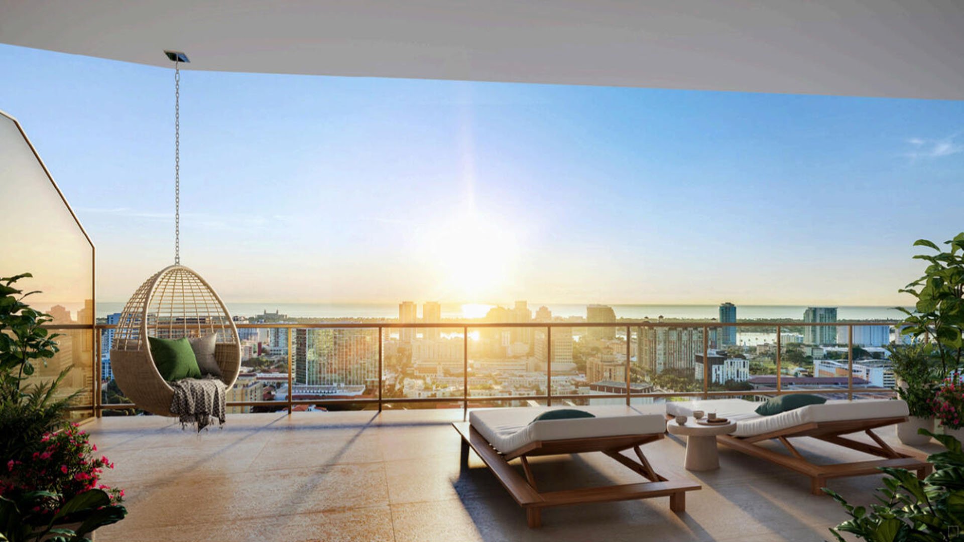 Open-air terrace with a hanging chair, sun loungers, and skyline views at The Berkeley in West Palm Beach, highlighting luxury and ultra luxury condos with expansive outdoor lounge space.