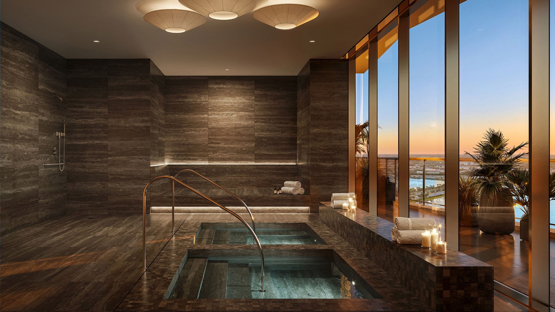Dark stone spa suite with dual plunge pools and sunset water views at The Berkeley in West Palm Beach, reflecting luxury and ultra luxury condos with a private wellness retreat.