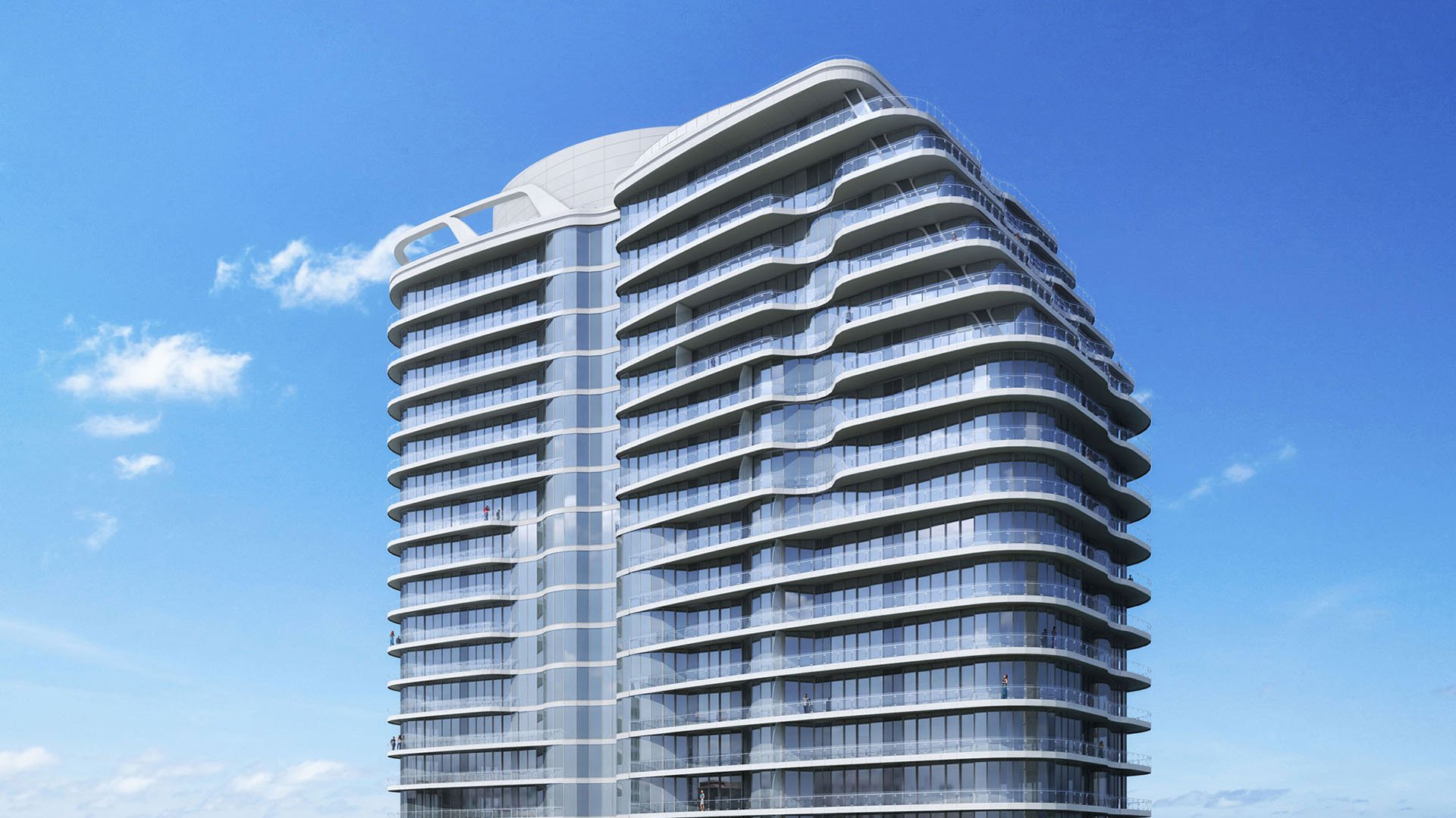 Curved glass tower exterior rising against a blue sky at The Bristol Palm Beach in Palm Beach, defining the architecture of these luxury and ultra luxury condos.