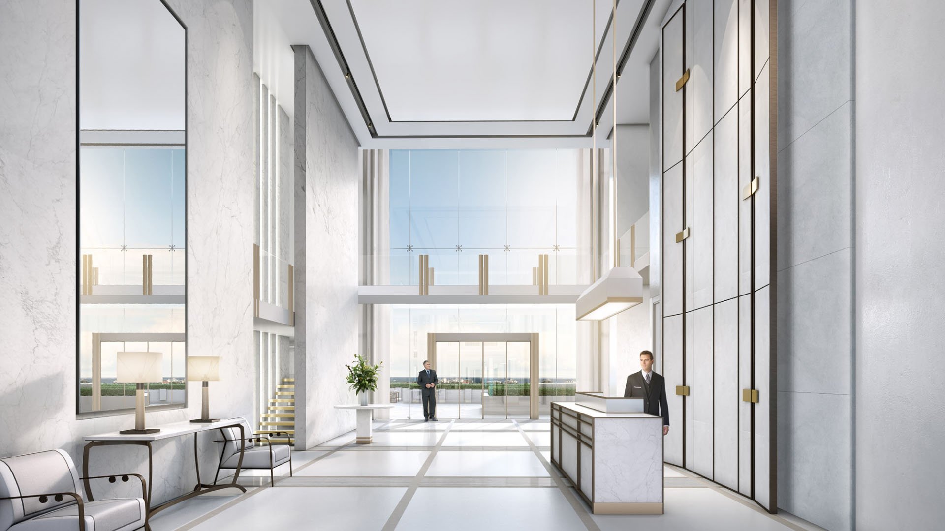 Double-height marble lobby with a reception desk and towering windows at The Bristol Palm Beach in Palm Beach, setting the tone for luxury and ultra luxury condos.