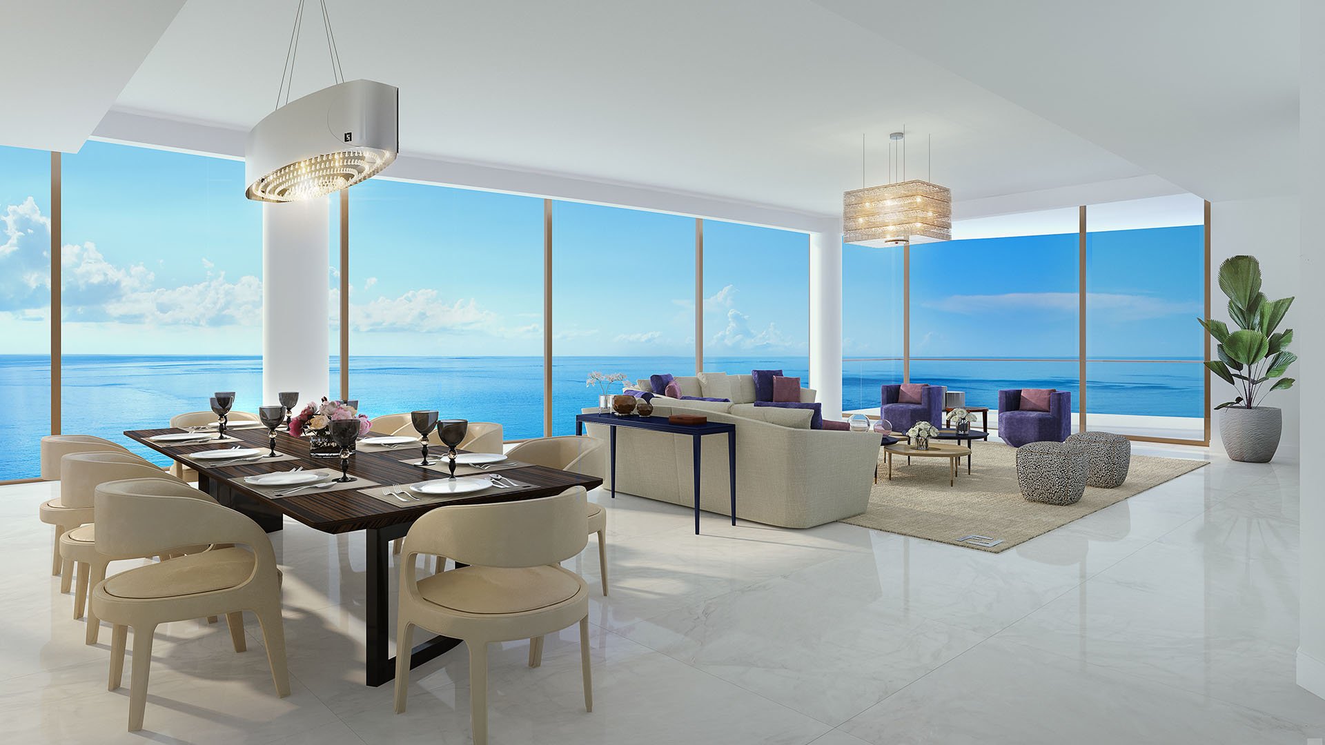 Dining and living room with panoramic ocean views and an open seating plan at The Estates at Acqualina, Sunny Isles Beach, a community of luxury and ultra luxury condos.