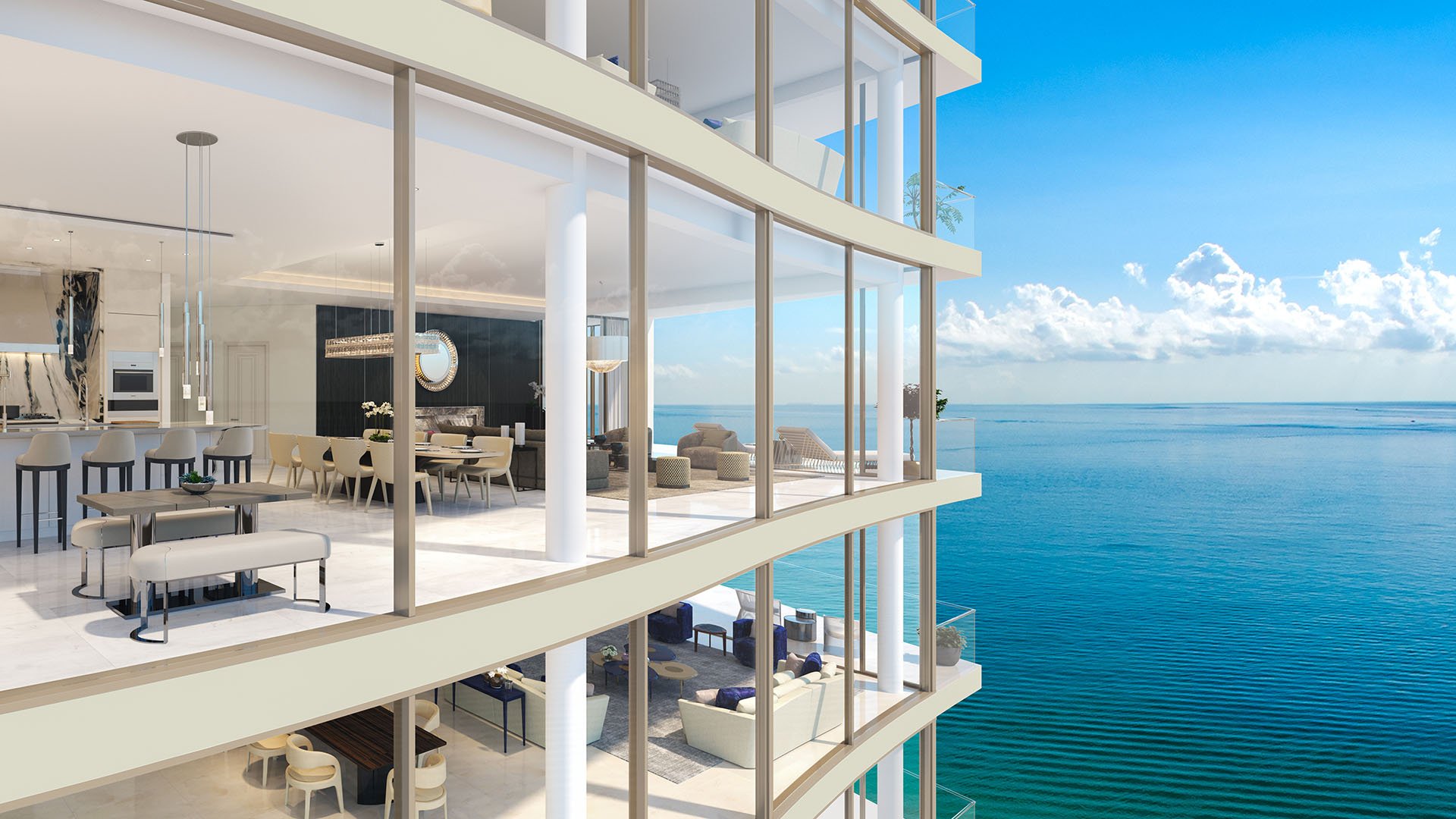 Glass balcony facade overlooking the ocean and corner terraces at The Estates at Acqualina, Sunny Isles Beach, a community of luxury and ultra luxury condos.