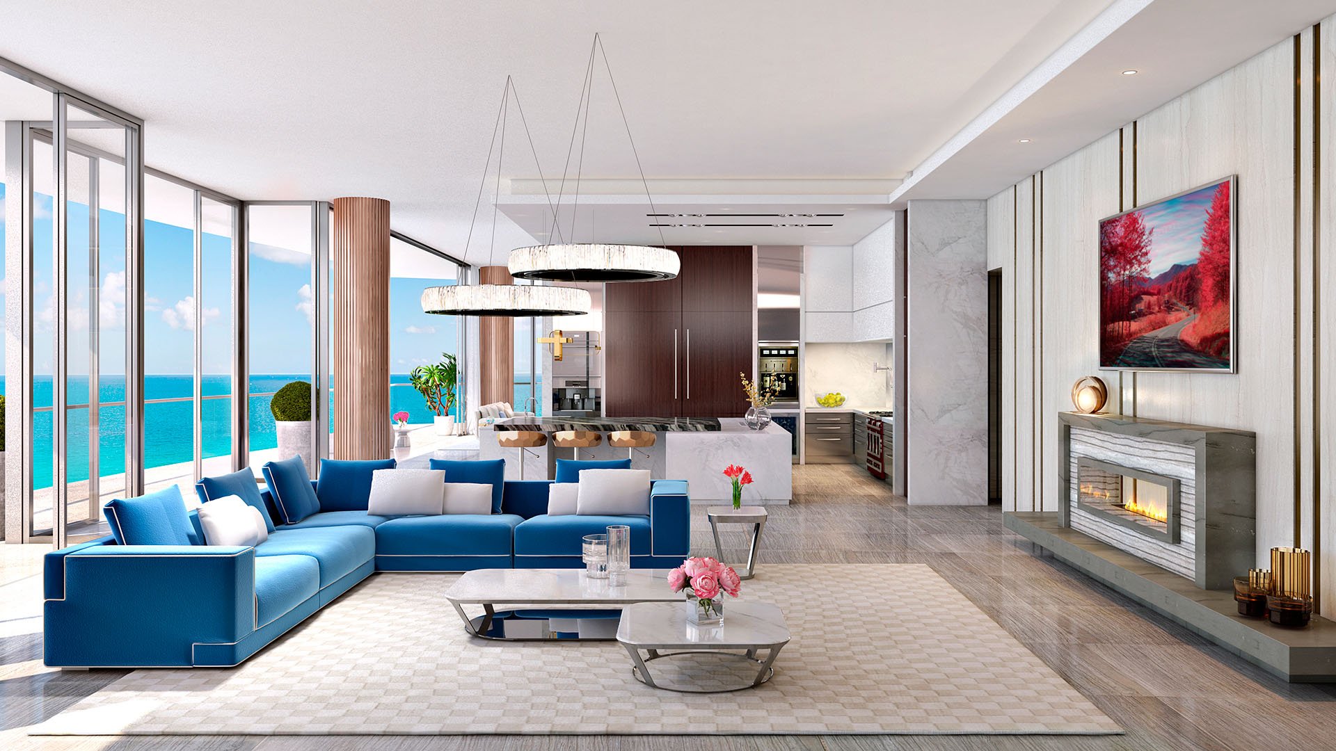 Great room with a blue sectional, fireplace, dining area, and oceanfront glass at The Estates at Acqualina, Sunny Isles Beach, a community of luxury and ultra luxury condos.
