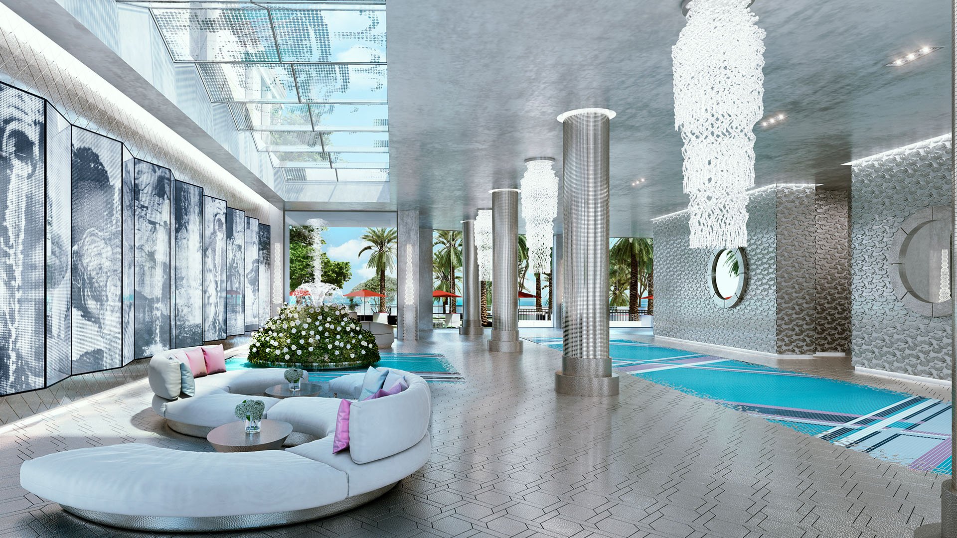 Indoor spa lap pool with lounge seating, columns, and skylights at The Estates at Acqualina, Sunny Isles Beach, a community of luxury and ultra luxury condos.