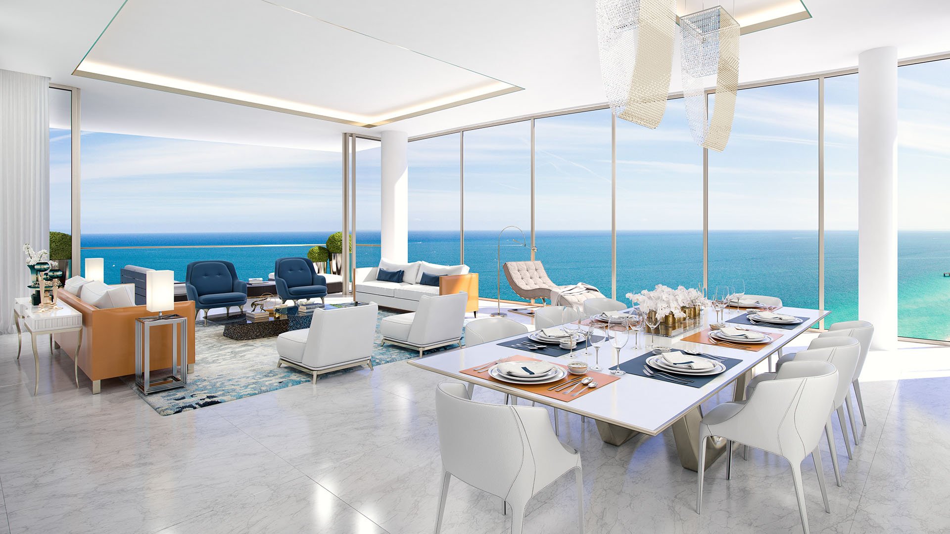 Oceanfront dining area with a table set for entertaining and open water views at The Estates at Acqualina, Sunny Isles Beach, a community of luxury and ultra luxury condos.