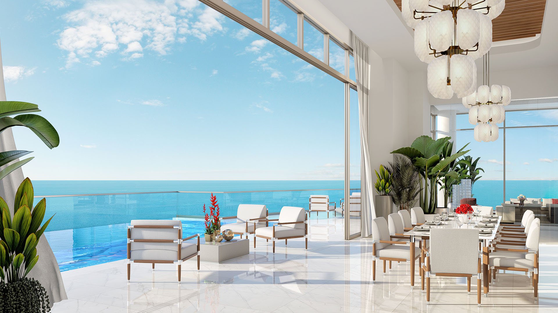 Oceanfront dining lounge opening to a terrace pool and horizon views at The Estates at Acqualina, Sunny Isles Beach, a community of luxury and ultra luxury condos.