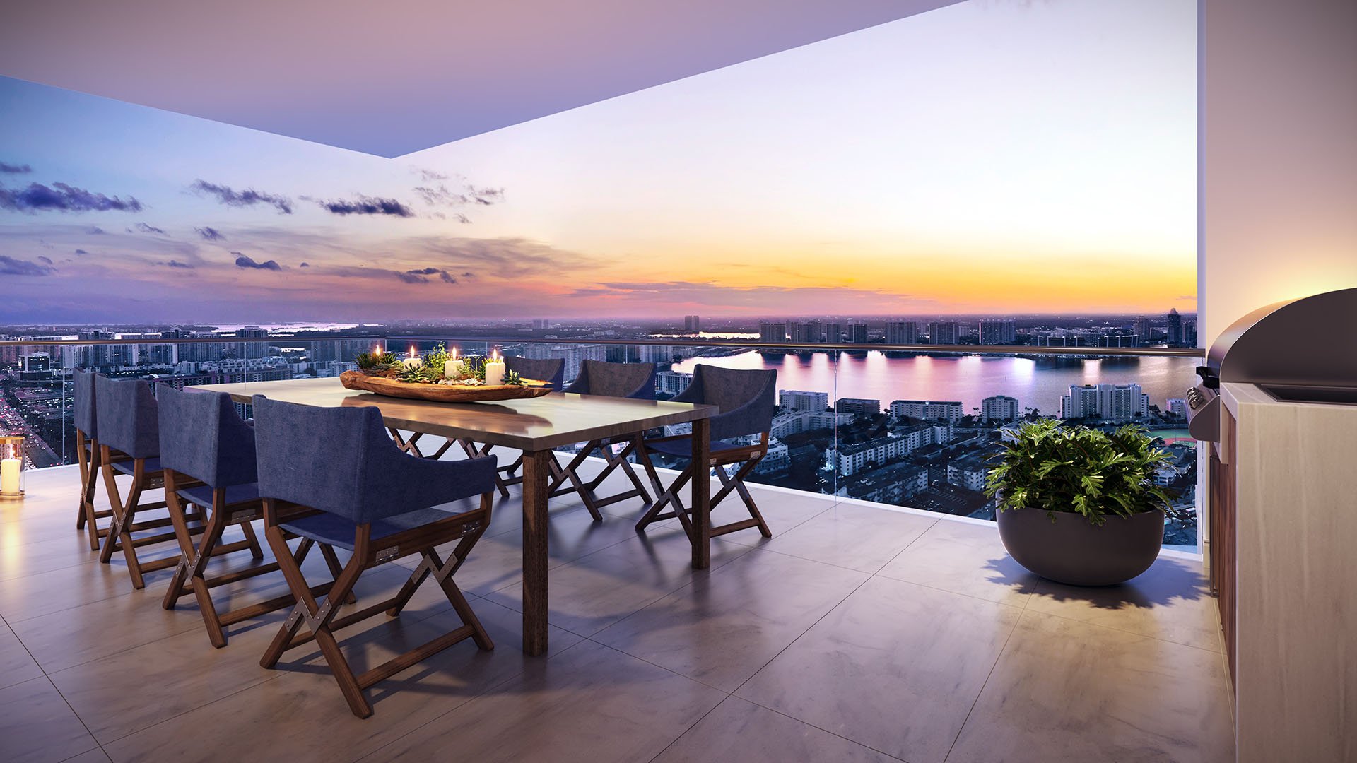 Rooftop dining terrace with sunset water views and outdoor entertaining space at The Estates at Acqualina, Sunny Isles Beach, a community of luxury and ultra luxury condos.