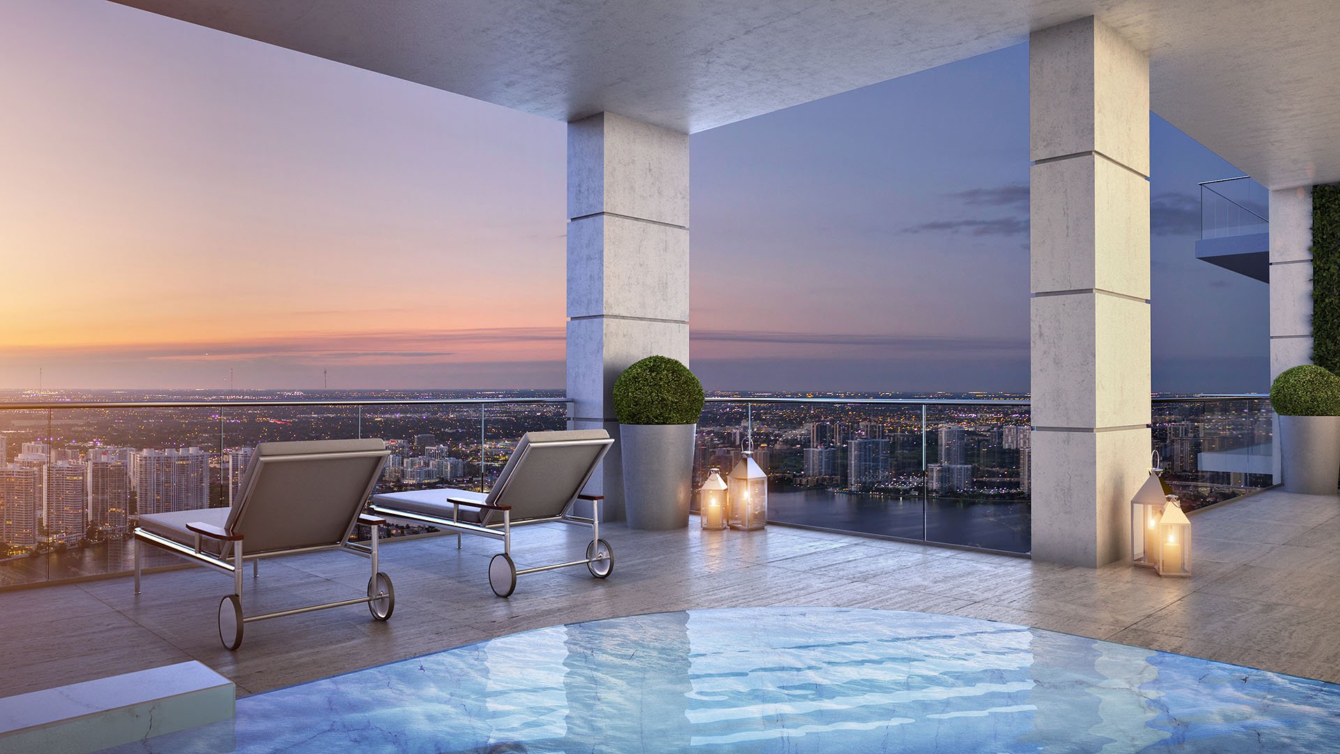 Sunset plunge pool terrace with lounge chairs and broad skyline views at The Estates at Acqualina, Sunny Isles Beach, a community of luxury and ultra luxury condos.