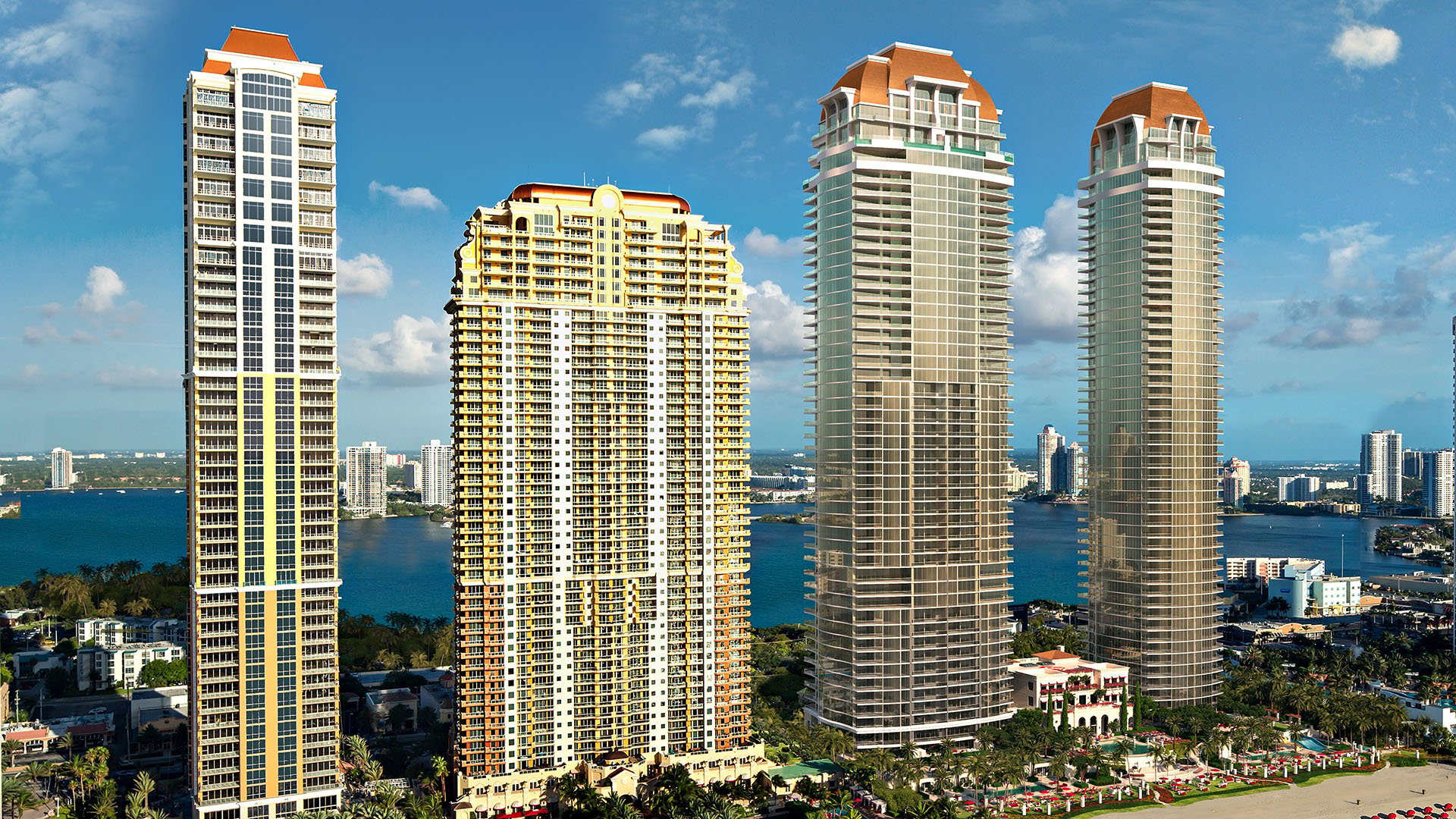 Aerial view of the waterfront condo tower collection at The Estates at Acqualina, Sunny Isles Beach, a community of luxury and ultra luxury condos.