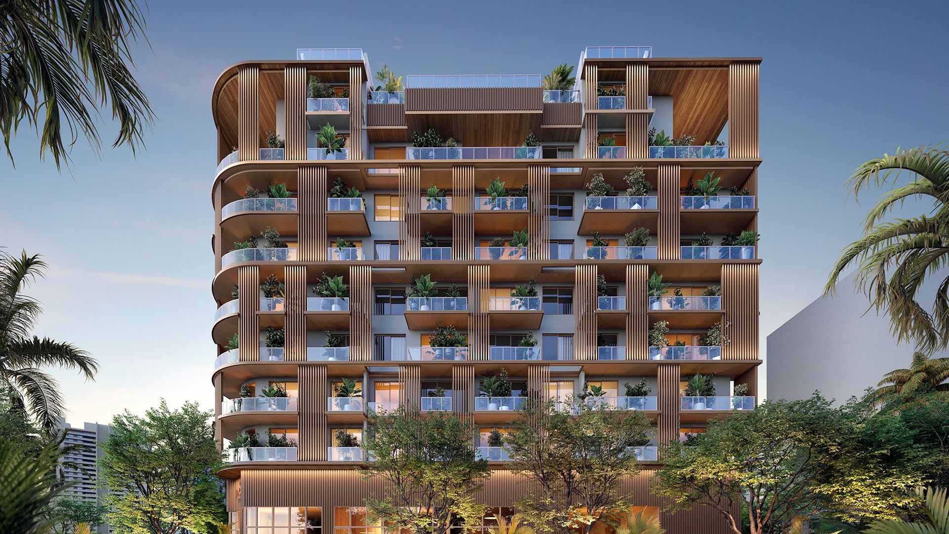 Dusk elevation of The Lincoln in Coconut Grove, Miami, Florida with ambient lighting, landscaped balconies and wood accents, presenting luxury and ultra luxury preconstruction condos lifestyle with illuminated terraces, rooftop levels and boutique mid-rise design.