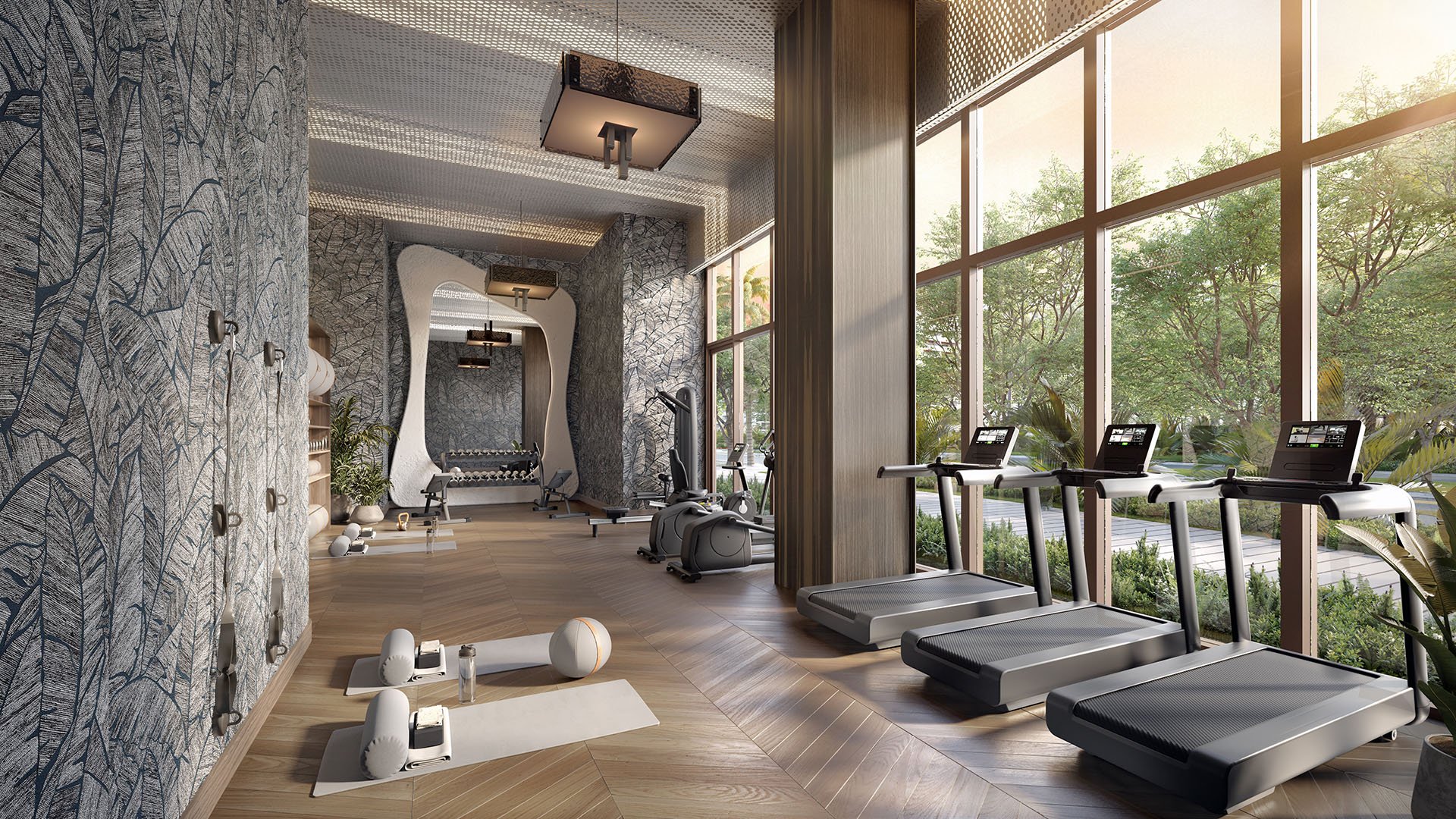 Fitness studio at The Lincoln Coconut Grove, Miami, Florida with treadmills by floor-to-ceiling windows, yoga area and modern equipment, highlighting luxury and ultra luxury preconstruction condos amenities with natural light, tropical landscaping views and wellness design.