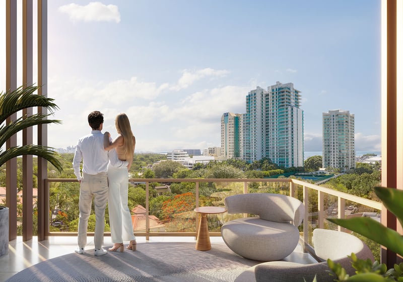 Private residence balcony at The Lincoln Coconut Grove, Miami, Florida with outdoor lounge seating and skyline views, highlighting luxury and ultra luxury preconstruction condos lifestyle with glass railing, shaded terrace screens and indoor-outdoor living overlooking the Grove.