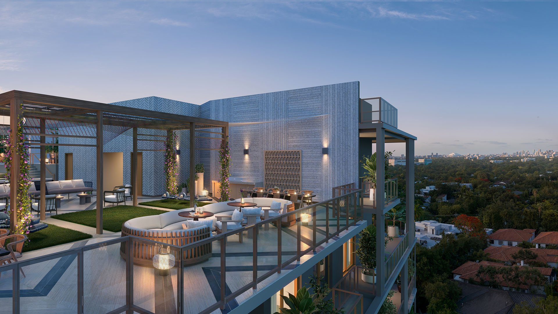 Rooftop terrace seating at The Lincoln Coconut Grove, Miami, Florida at dusk with glass railings and skyline outlook, highlighting luxury and ultra luxury preconstruction condos amenities with intimate lounge clusters, warm lighting and elevated city views above the Grove.