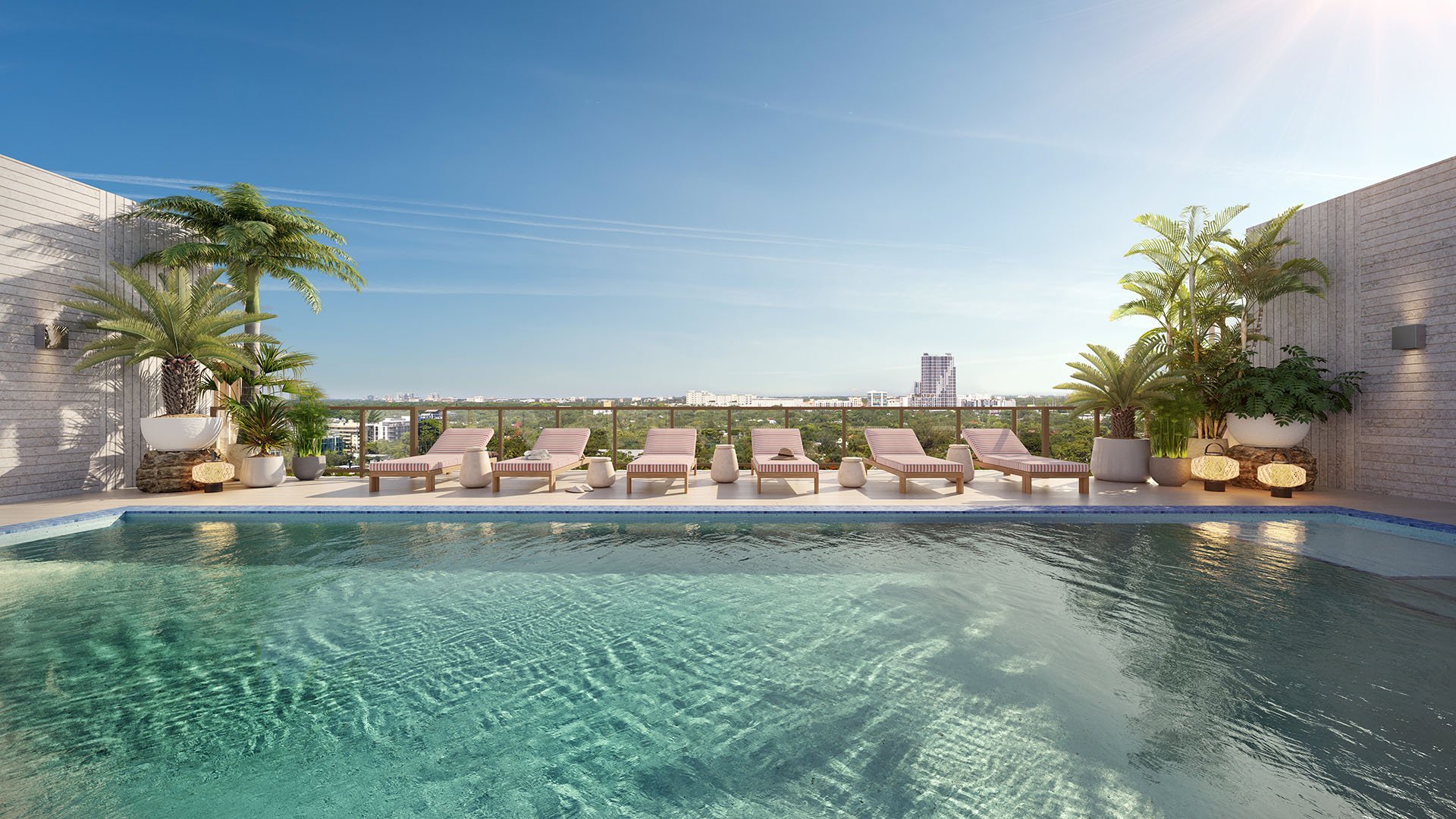 Daytime rooftop pool and sundeck at The Lincoln Coconut Grove, Miami, Florida with lounge chairs, palms and horizon views, featuring luxury and ultra luxury preconstruction condos amenities with resort pool, sun loungers, landscaped planters and open-sky setting.