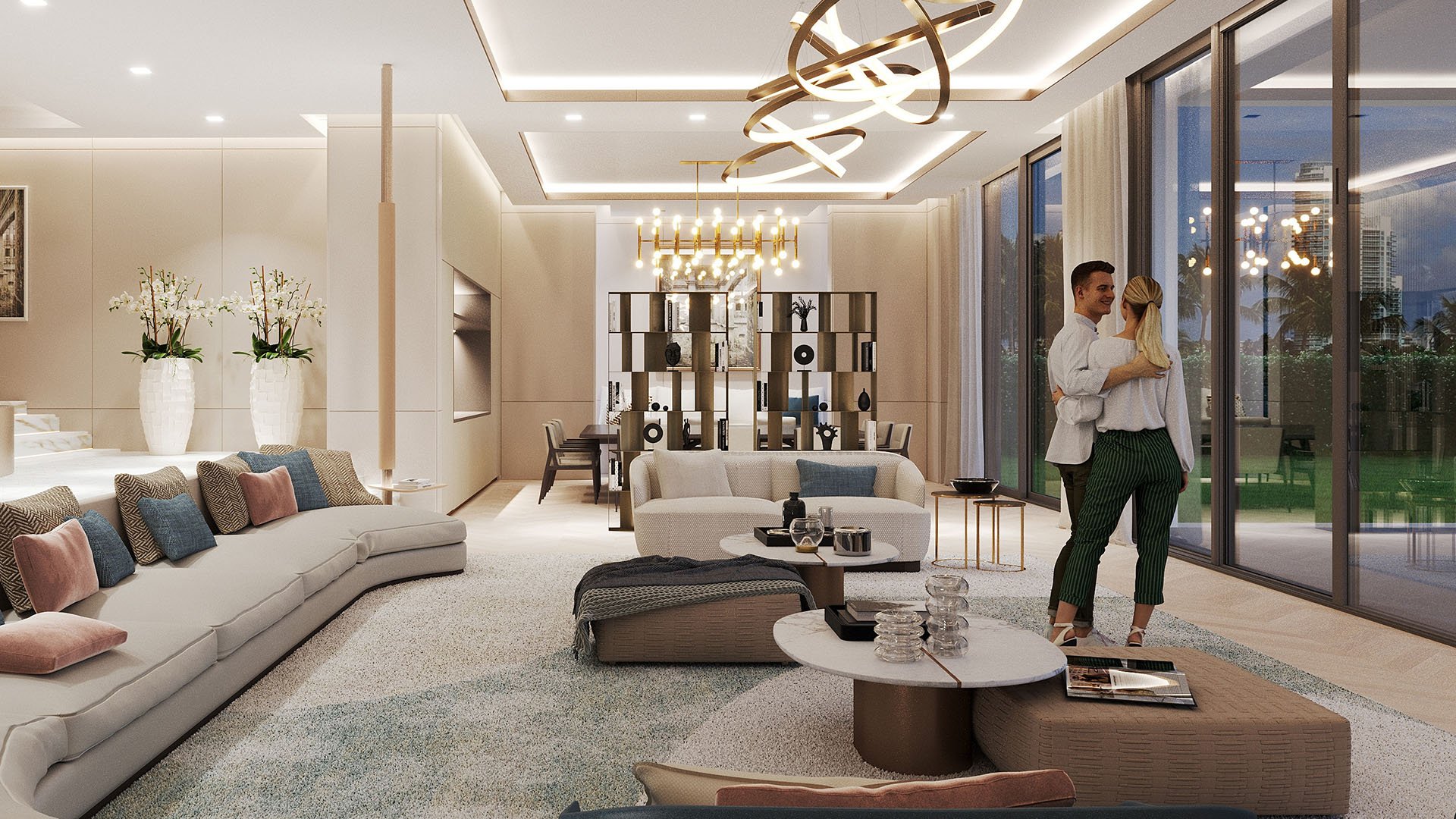 The Links Estates, Fisher Island, Miami Beach, Florida evening open-plan living room with curved sectional, dining area and waterfront glazing, capturing luxury and ultra luxury preconstruction condos ambiance.