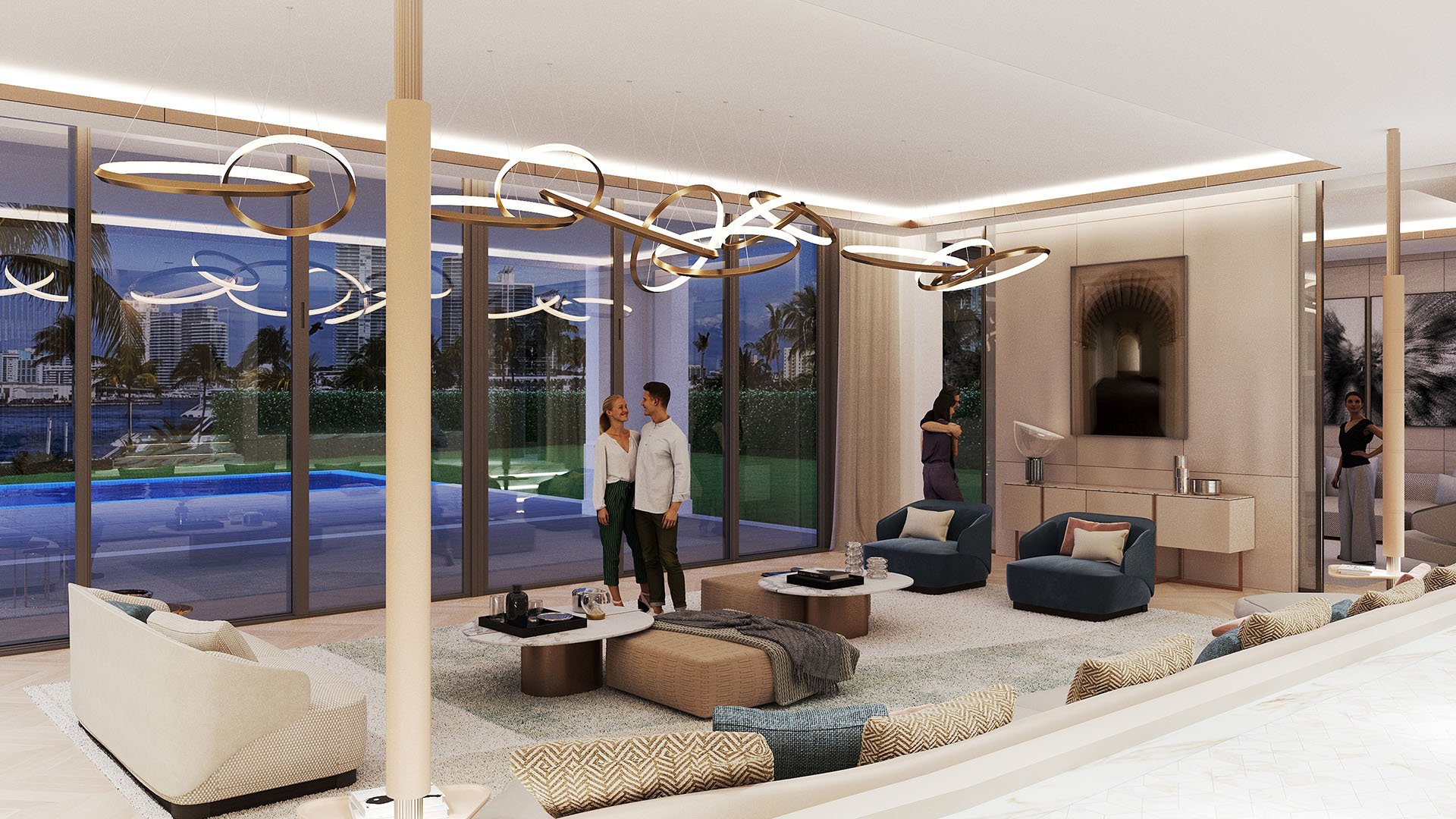 The Links Estates, Fisher Island, Miami Beach, Florida twilight living room with floor-to-ceiling glass, waterfront view, blue lounge chairs and ring chandelier, featuring luxury and ultra luxury preconstruction condos.