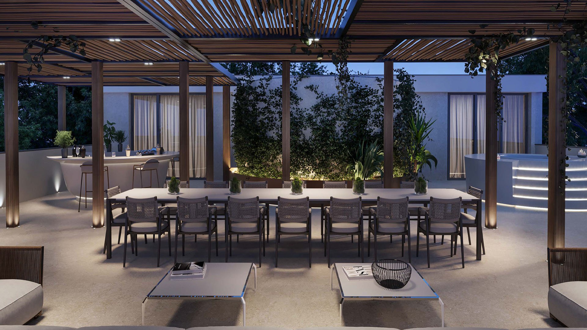 The Links Estates, Fisher Island, Miami Beach, Florida rooftop terrace at night with long dining table, pergola, outdoor bar, hot tub and lush planter wall, featuring luxury and ultra luxury preconstruction condos.