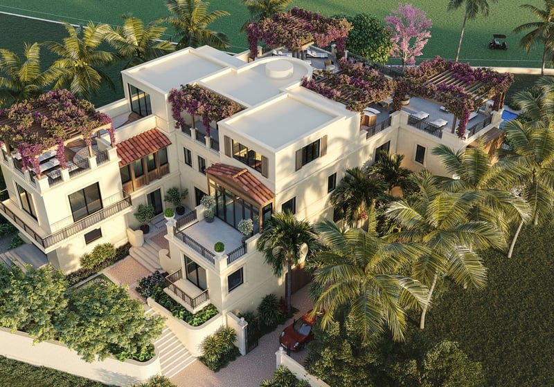 Aerial front entrance at The Links Estates, Fisher Island, Miami Beach, Florida, featuring gated driveway, rooftop garden terraces, palms, and bougainvillea pergolas - luxury and ultra luxury preconstruction condos and villa residences.