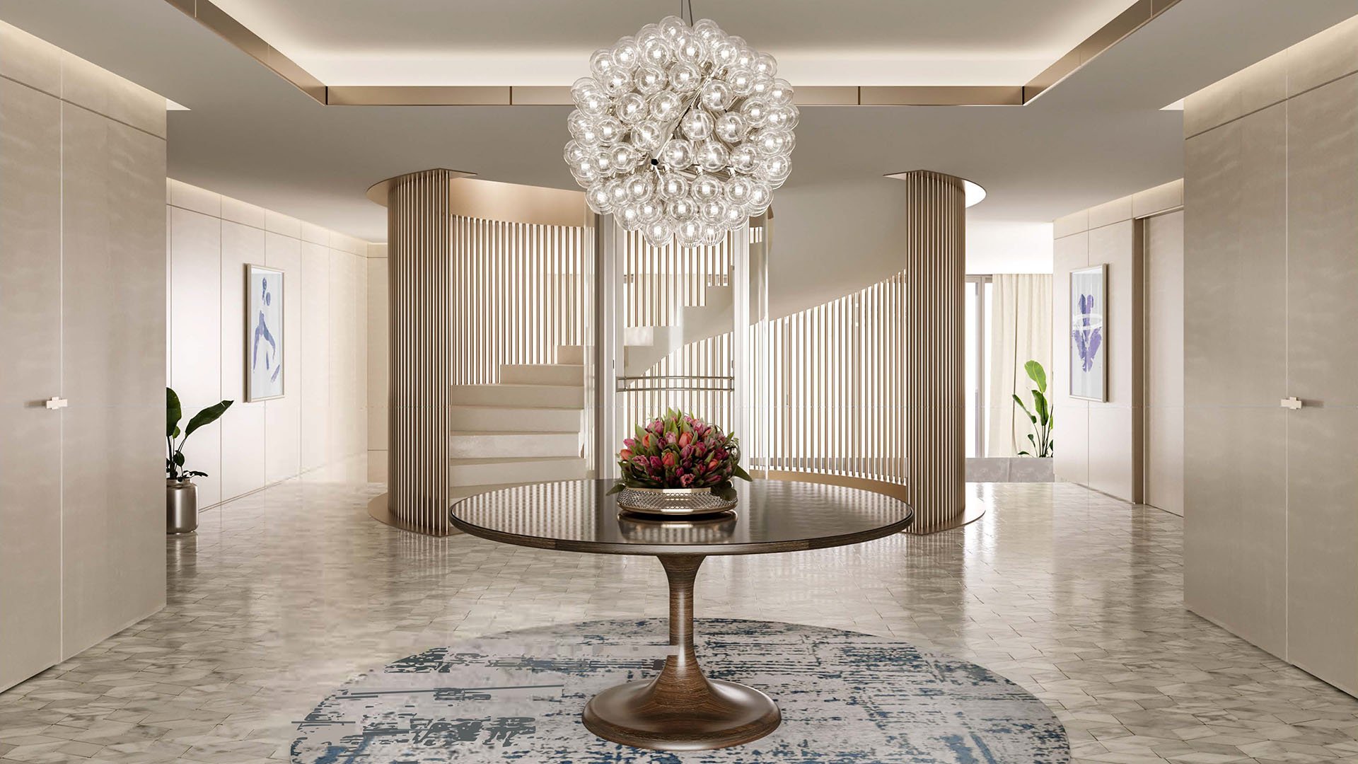 Grand foyer at The Links Estates, Fisher Island, Miami Beach, Florida, featuring spiral staircase, glass bubble chandelier, marble floors, and round console table - luxury and ultra luxury preconstruction condos and villa interiors.