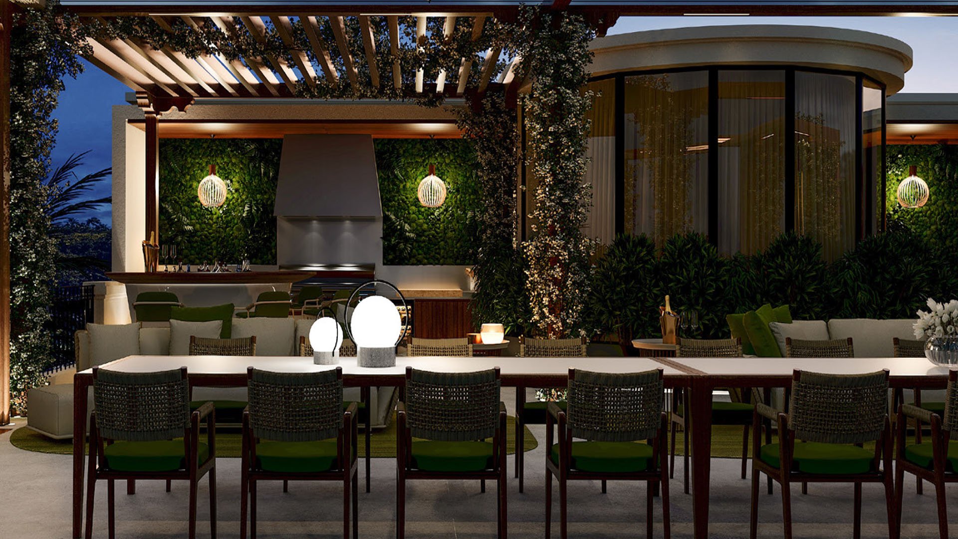 Night outdoor dining terrace at The Links Estates on Fisher Island, Miami Beach, Florida, with pergola, long table, outdoor kitchen grill and bar, curved glass pavilion, and ambient lighting - luxury and ultra luxury preconstruction condos.