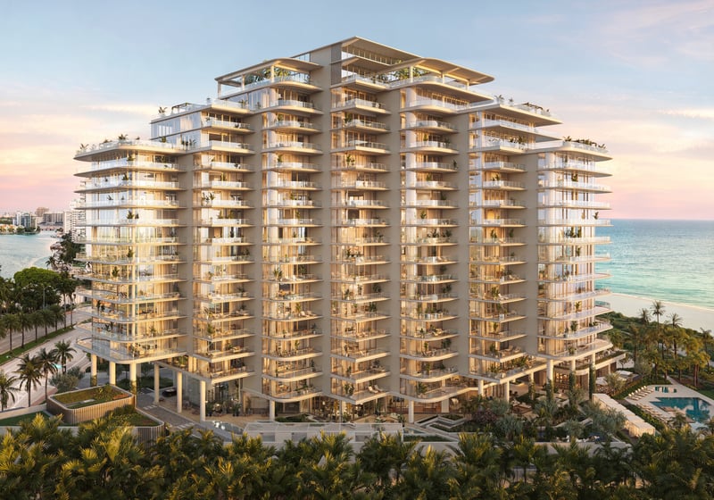 The Perigon Miami Beach oceanfront condo at sunset, glass tower over the Atlantic. Miami Beach luxury and ultra luxury condos, preconstruction.