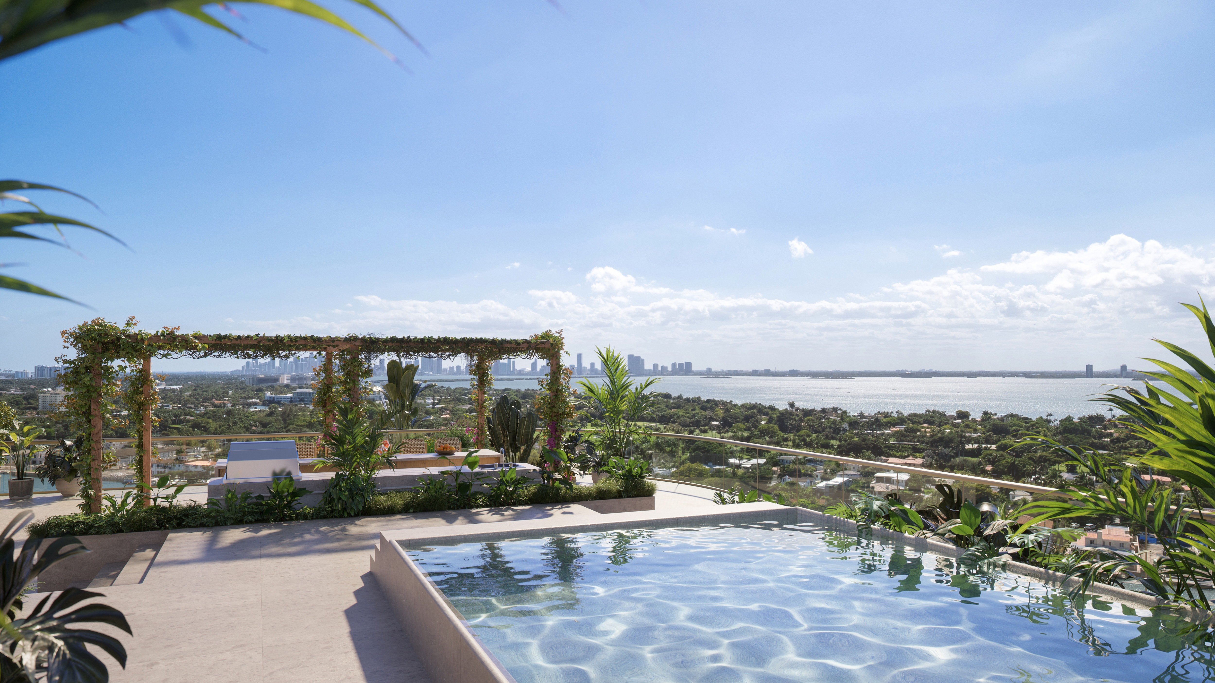 The Perigon Miami Beach rooftop pool with Miami skyline and ocean views. Miami Beach luxury and ultra luxury condos, preconstruction. Featuring view.