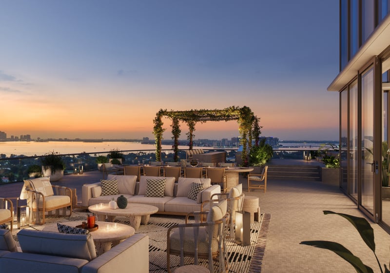 The Perigon Miami Beach rooftop lounge at sunset, skyline and ocean vistas for luxury and ultra luxury condos; preconstruction. Featuring view.