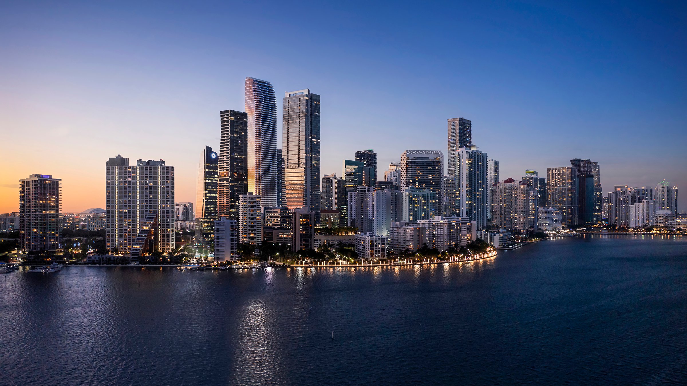 The Residences at 1428 Brickell dusk skyline view over Biscayne Bay. Brickell, Miami; landmark for luxury and ultra luxury condos, preconstruction.