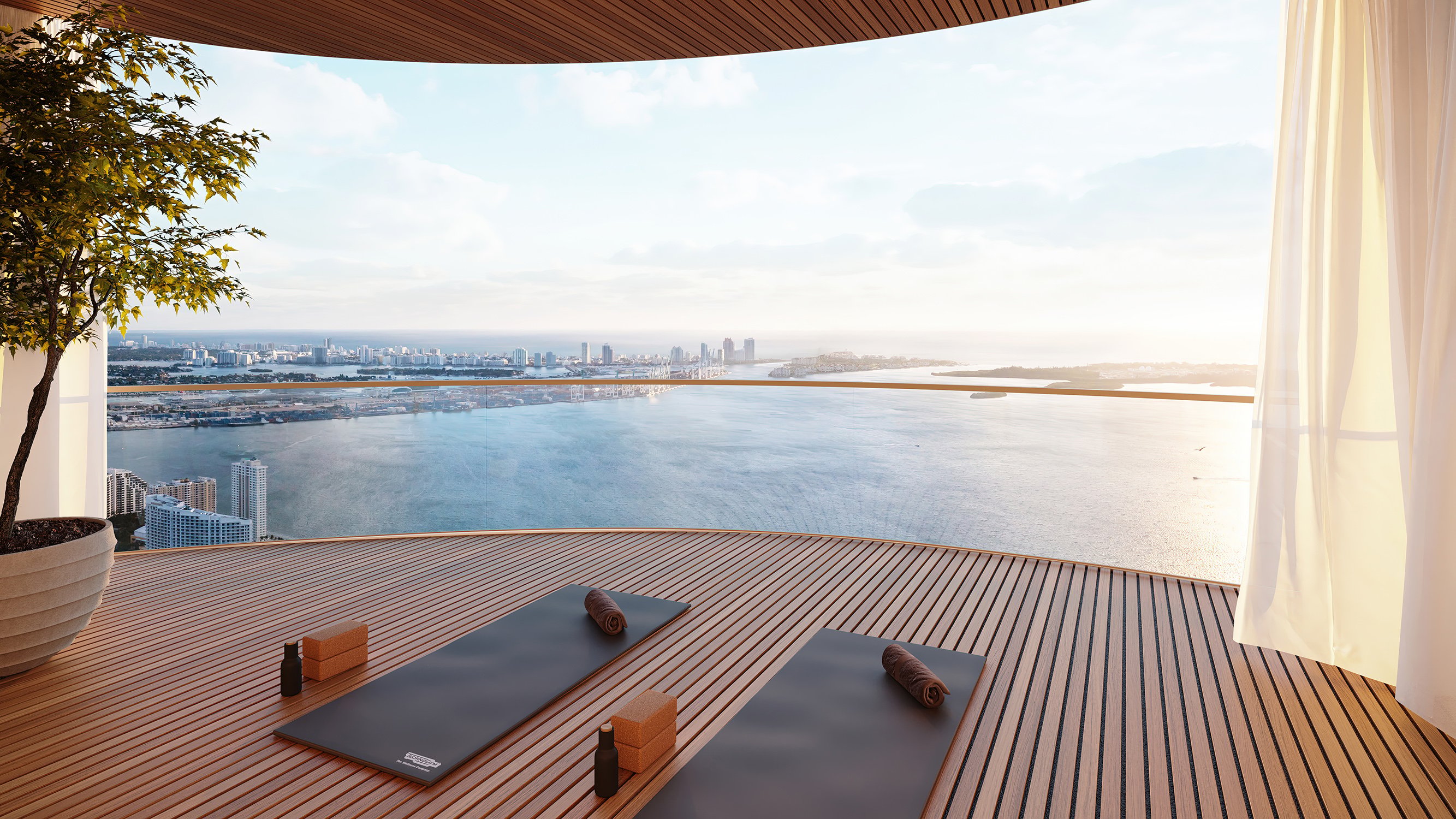 The Residences at 1428 Brickell yoga on balcony at waterfront sunset. Brickell, Miami; wellness lifestyle in luxury and ultra luxury condos; preconstruction.