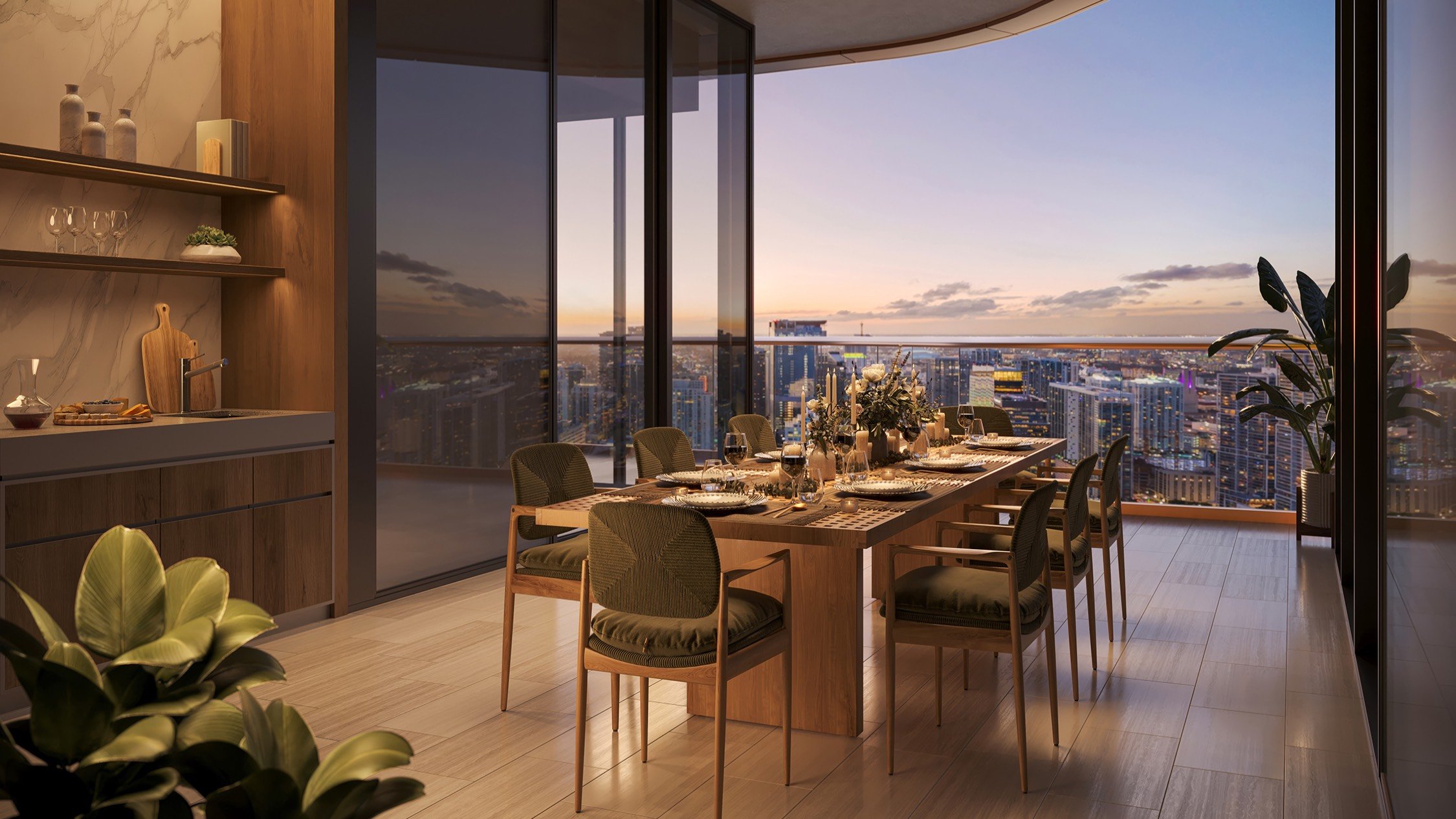 Sunset dining room with city skyline at The Residences at Mandarin Oriental, Miami Tower Two; luxury setting for ultra luxury preconstruction condos in Miami. Featuring elegant and view.
