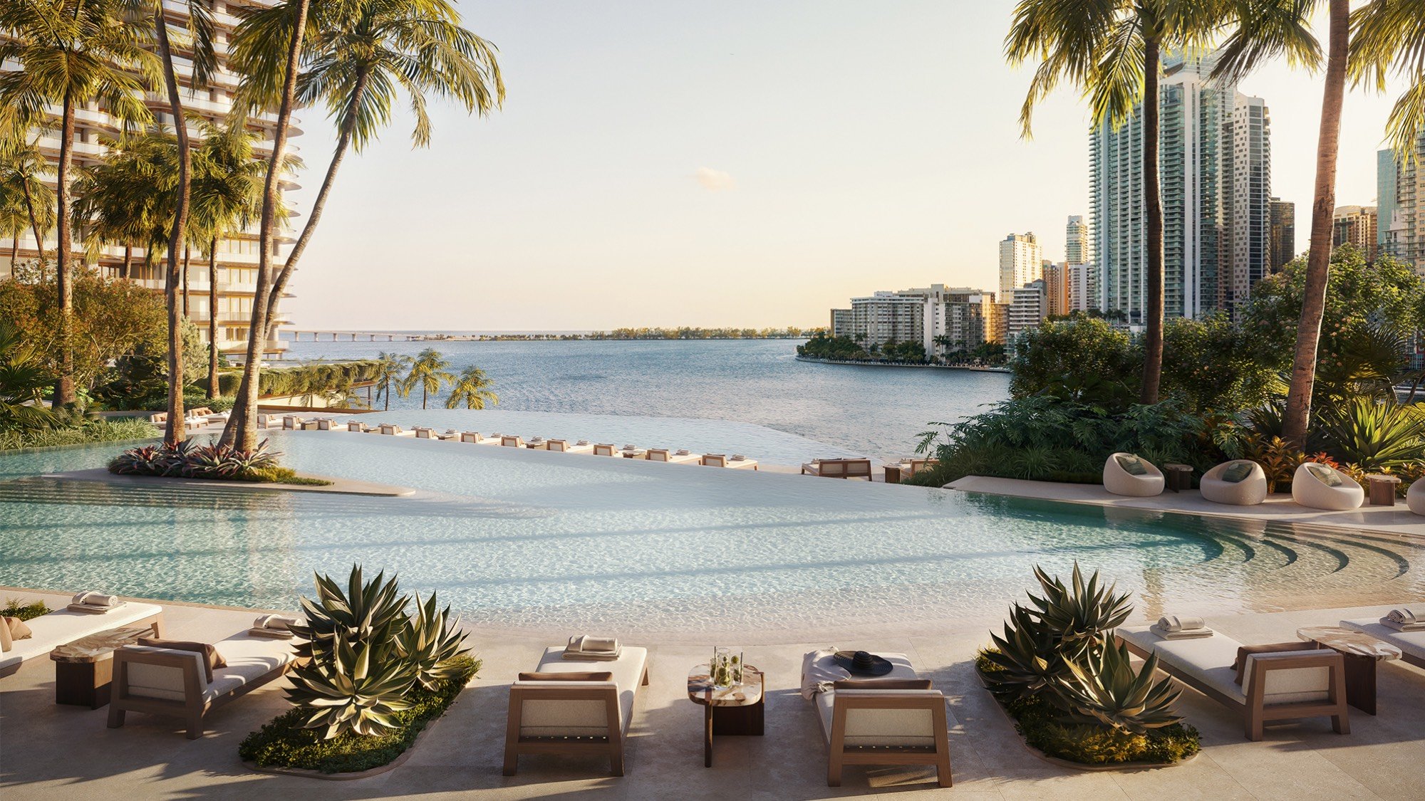 Pool with cityscape backdrop at The Residences at Mandarin Oriental, Miami Tower Two; luxury amenity for ultra luxury preconstruction condos on the Miami waterfront. Featuring poolside and view.