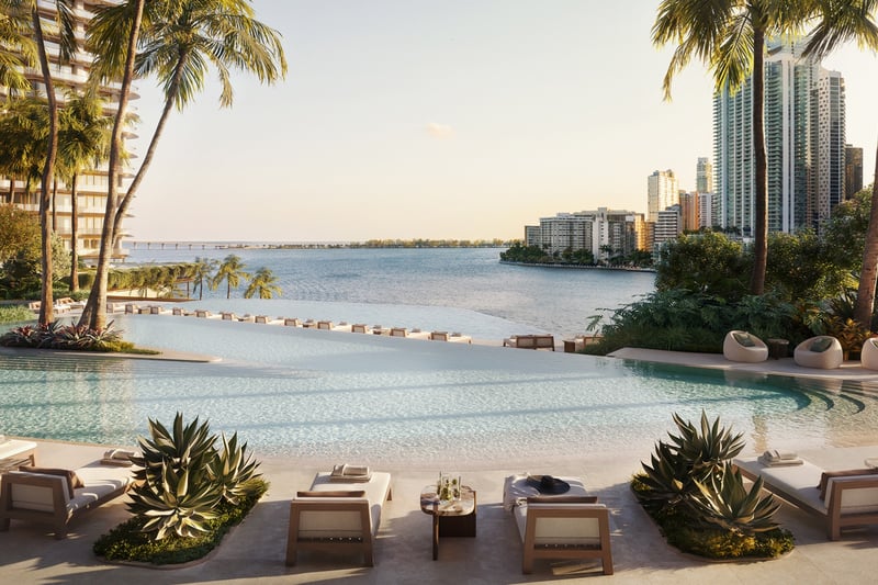 Pool with cityscape backdrop at The Residences at Mandarin Oriental, Miami Tower Two; luxury amenity for ultra luxury preconstruction condos on the Miami waterfront. Featuring poolside and view.