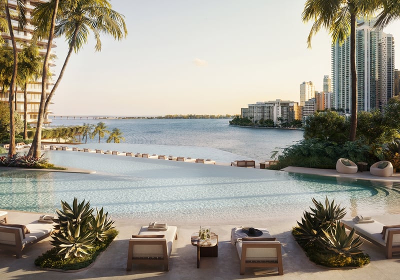 Pool with cityscape backdrop at The Residences at Mandarin Oriental, Miami Tower Two; luxury amenity for ultra luxury preconstruction condos on the Miami waterfront. Featuring poolside and view.