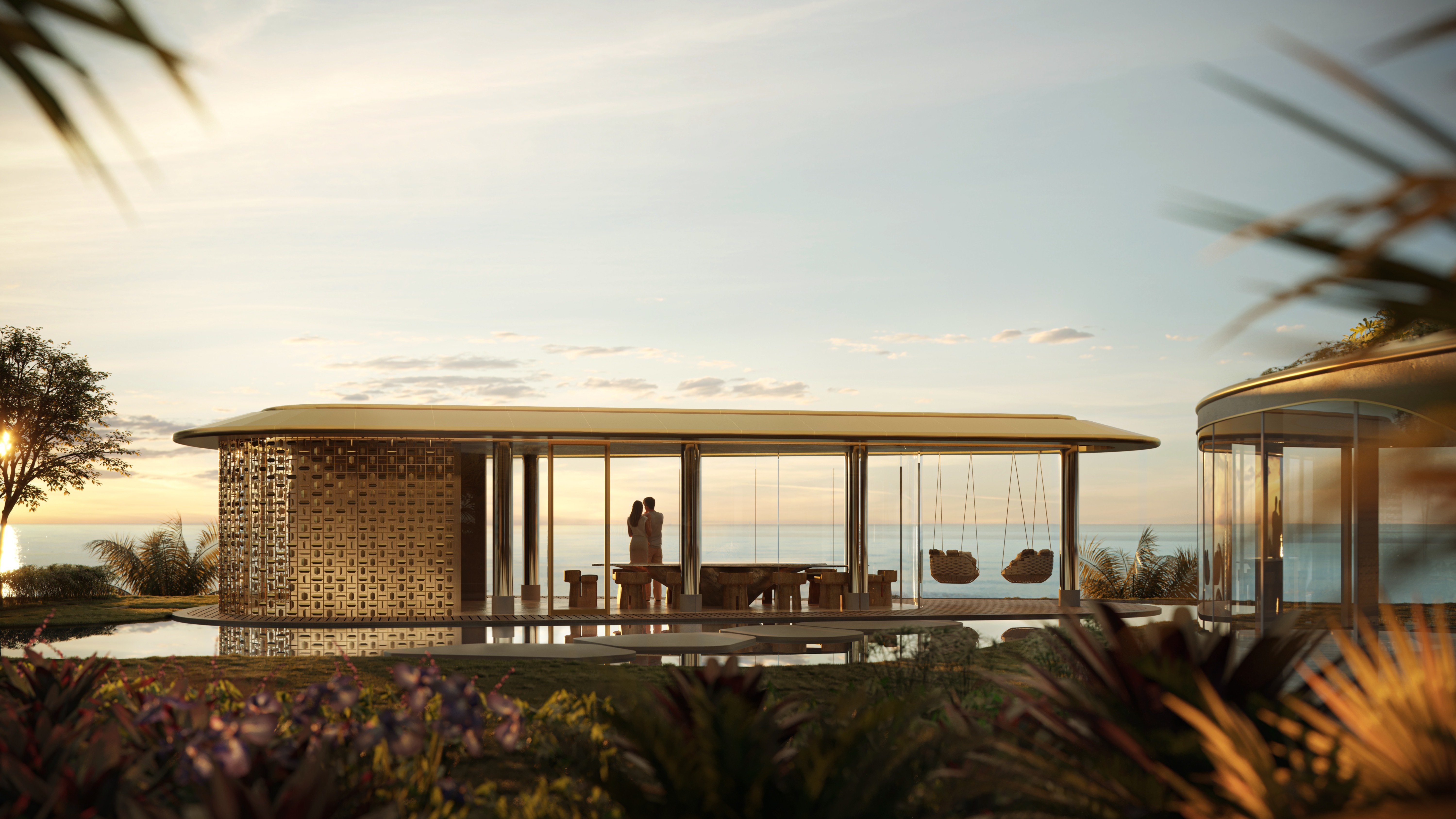 Couple at sunset on modern waterfront deck, lifestyle image for The Residences at Mandarin Oriental, Miami Tower Two; luxury ambiance for ultra luxury preconstruction condos. Featuring beach and house.