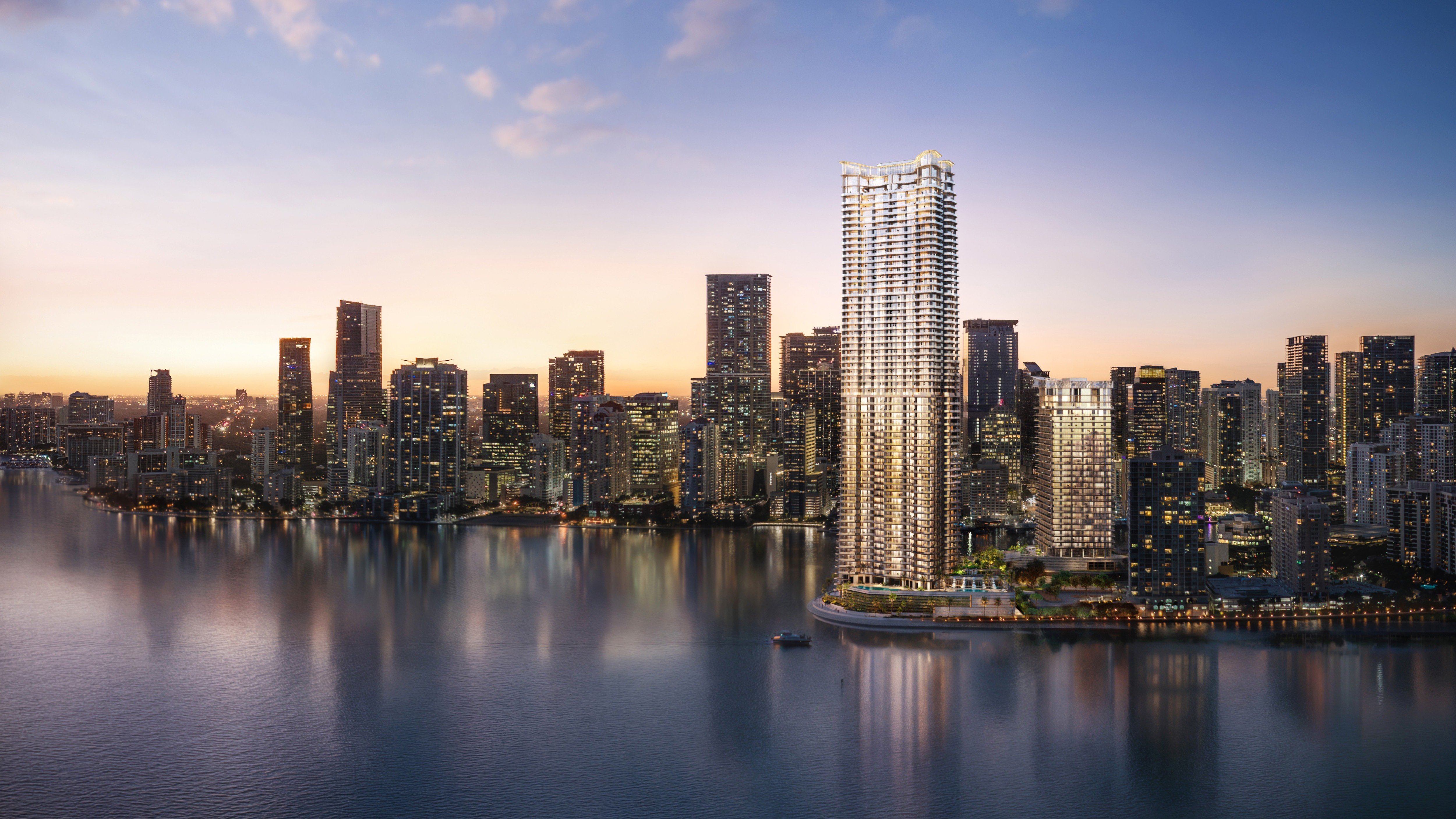 Sunset skyline reflecting on Biscayne Bay at The Residences at Mandarin Oriental, Miami Tower Two, ultra luxury condos in preconstruction on Brickell Key, showcasing luxury waterfront living. Featuring modern and reflection.