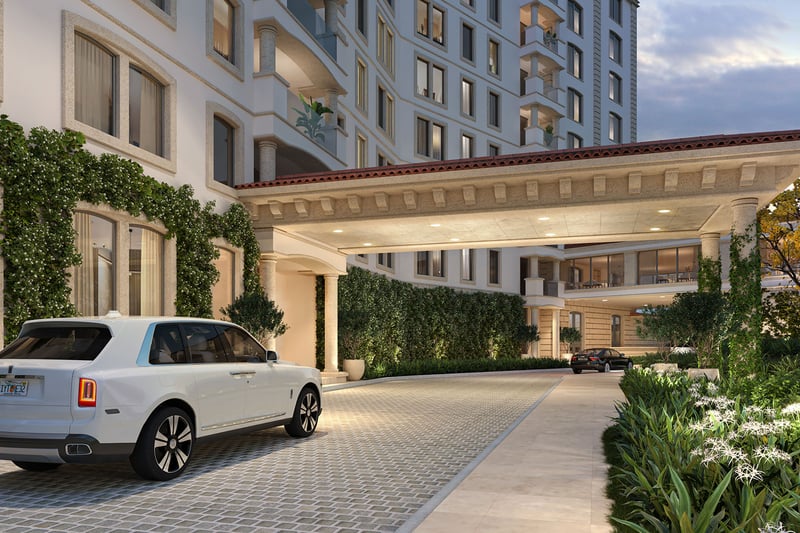 Porte cochere arrival at The Residences at Six Fisher Island, Fisher Island Miami Beach, Florida, featuring valet drop-off and covered driveway with lush landscaping, representing luxury and ultra luxury preconstruction condos.
