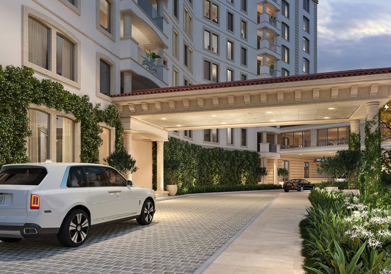 Porte cochere arrival at The Residences at Six Fisher Island, Fisher Island Miami Beach, Florida, featuring valet drop-off and covered driveway with lush landscaping, representing luxury and ultra luxury preconstruction condos.