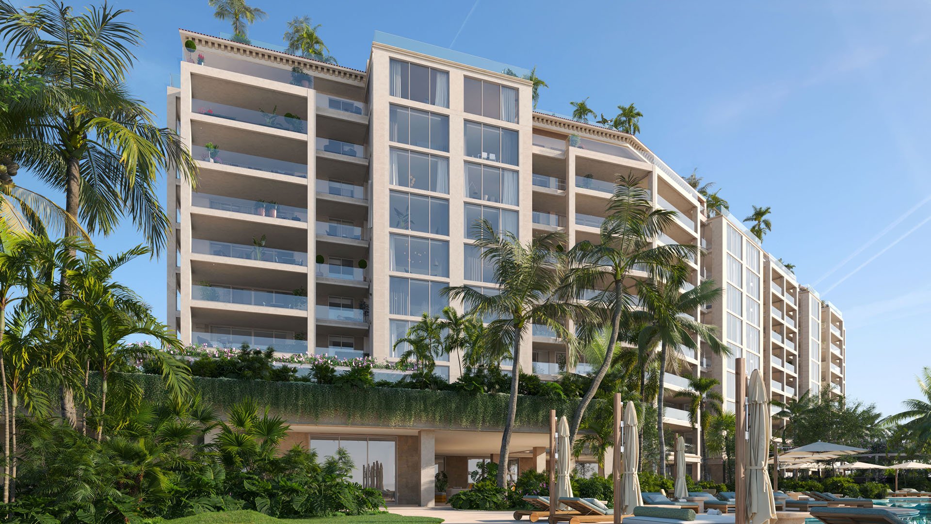 Resort-style pool deck and facade of The Residences at Six Fisher Island, Fisher Island Miami Beach, Florida, framed by palm trees and spacious terraces, marketing luxury and ultra luxury preconstruction condos.