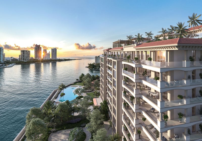 Hummingbird Residence balcony view at The Residences at Six Fisher Island, Fisher Island Miami Beach, Florida, sunrise over Government Cut and Miami Beach skyline with pool gardens below, showcasing luxury and ultra luxury preconstruction condos.