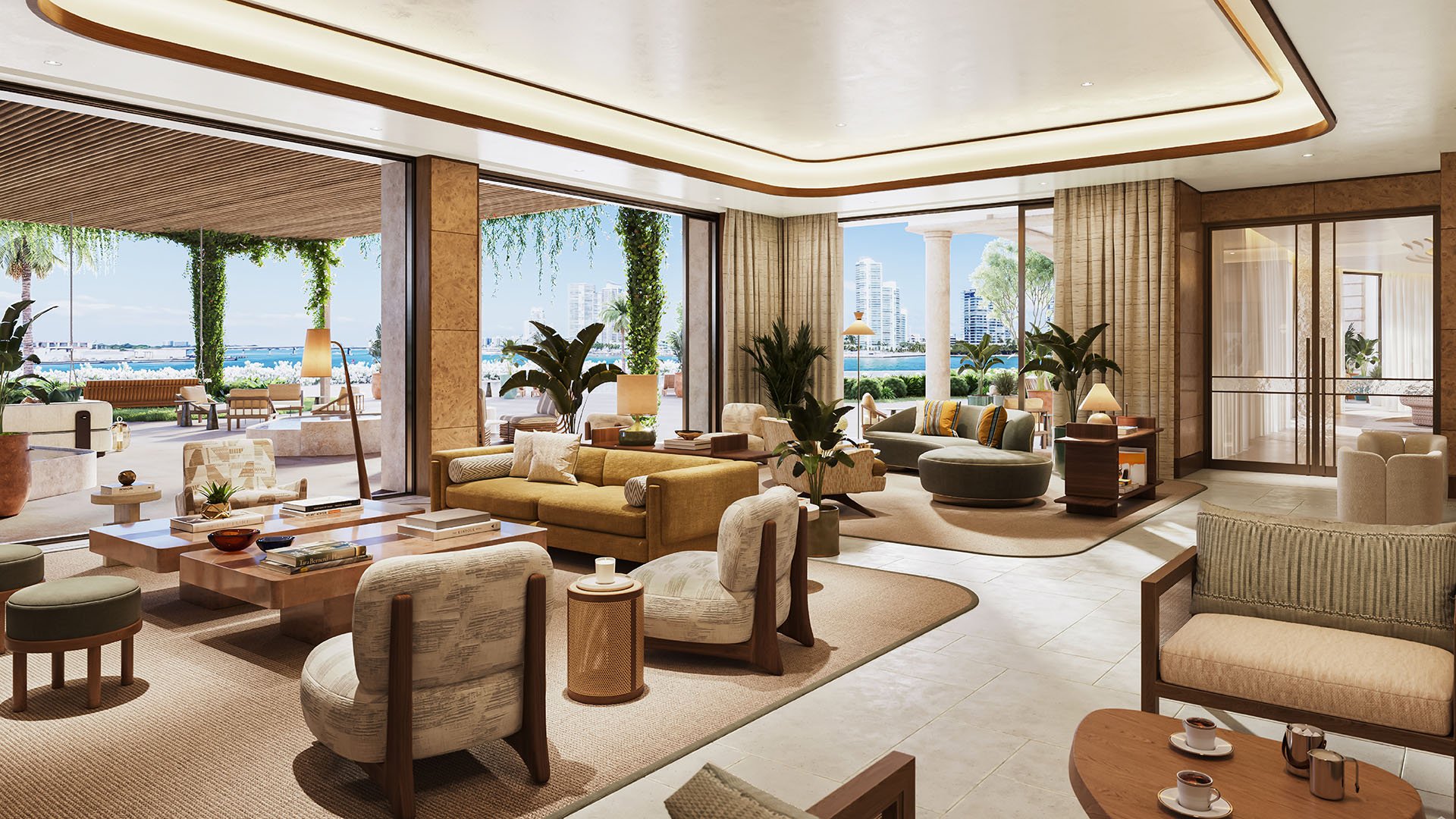 Open-plan living room with multiple seating areas and wide glass openings to Biscayne Bay at The Residences at Six Fisher Island, Fisher Island Miami Beach Florida; luxury and ultra luxury preconstruction condos.